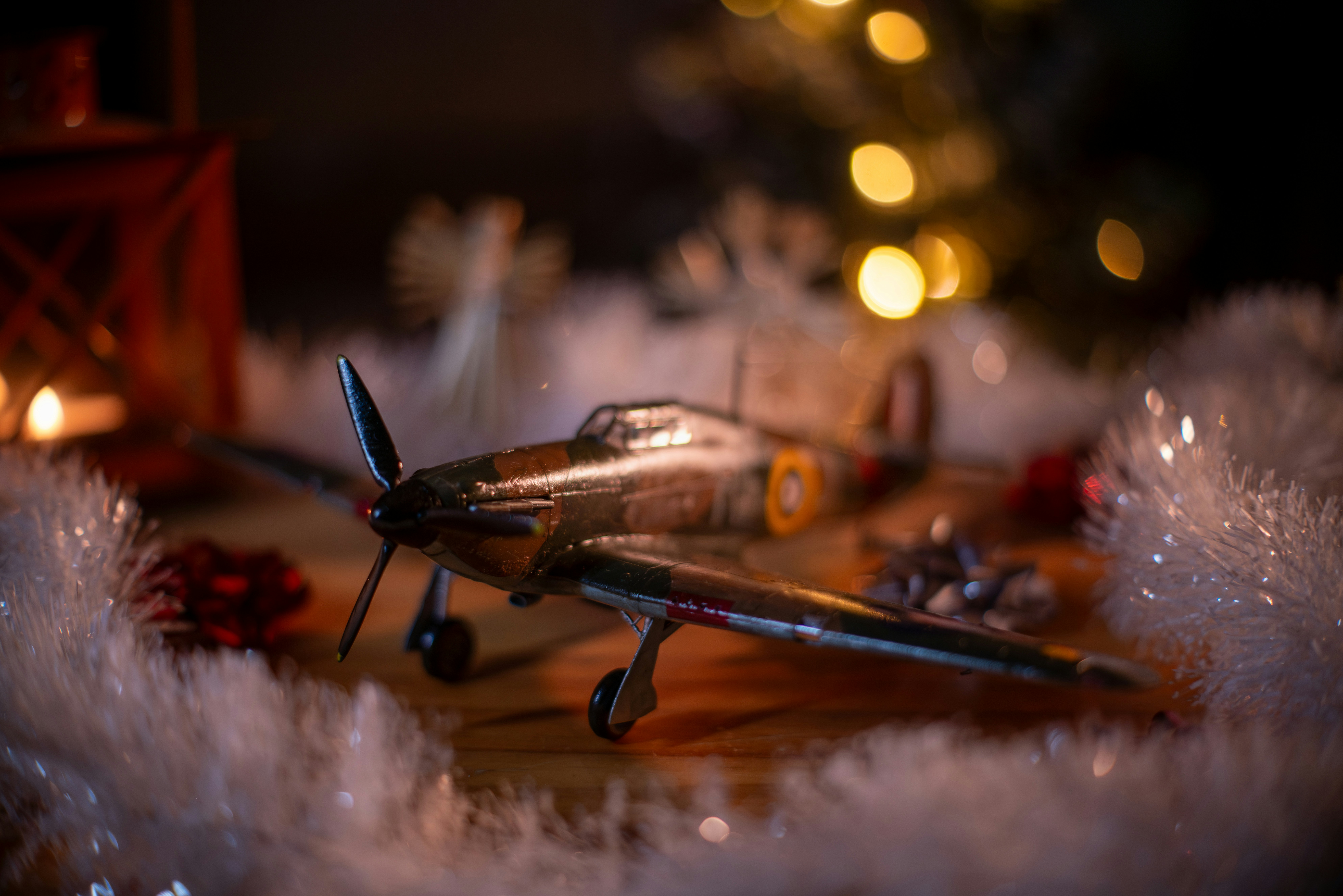 Model airplane with christmas decorations and lights.