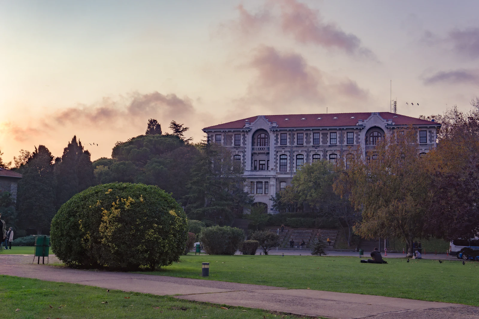 University campus building and lawn at sunset, the kind of place a Canadian exchange student uses mobile data every day