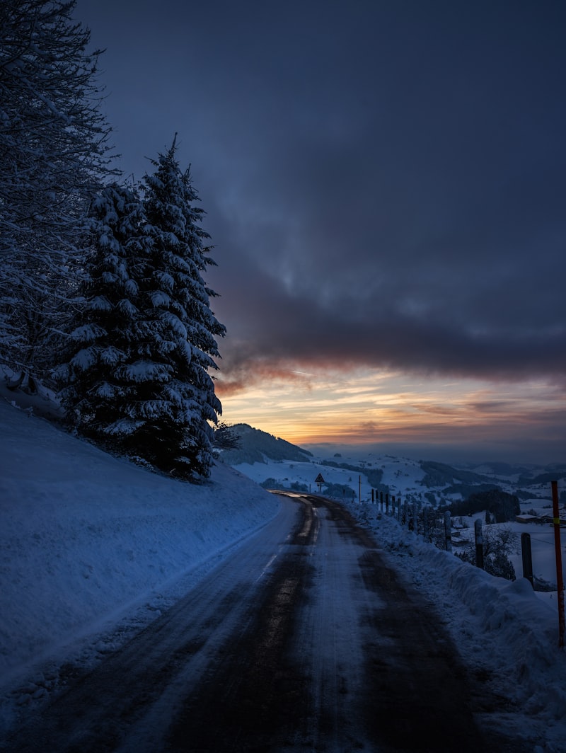 snowy road, snow-covered landscape, heavy snowfall, winter weather conditions, mountain pass