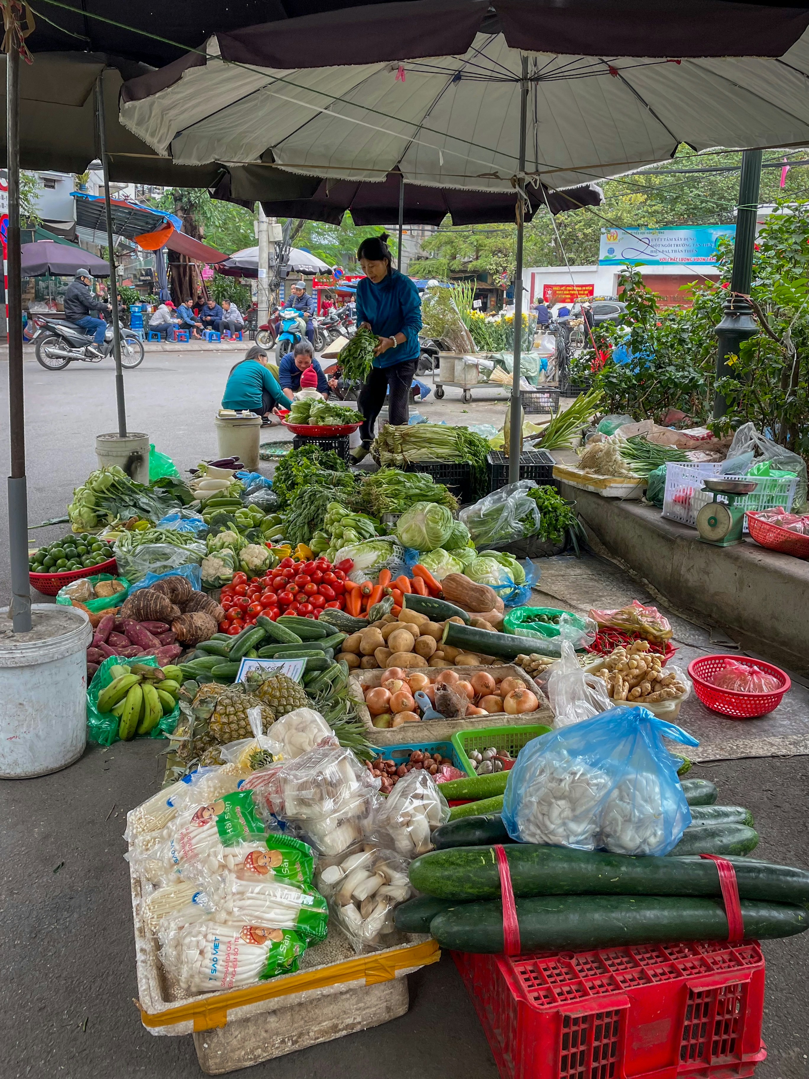 Fresh produce displayed at outdoor market stall, vibrant vegetables. Photo by Bernd Dittrich on Unsplash.