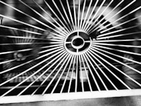 Close-up of a metal grate with circular pattern