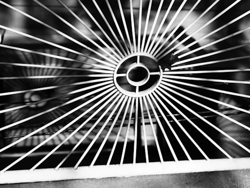 Close-up of a metal grate with circular pattern