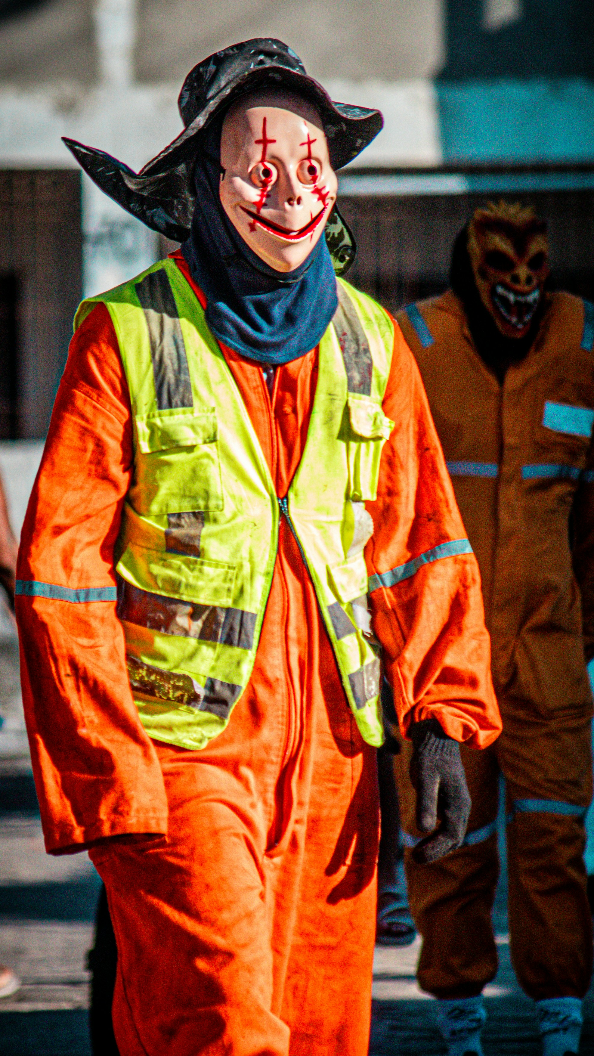 Smiling construction worker portrait in orange hard hat and safety vest