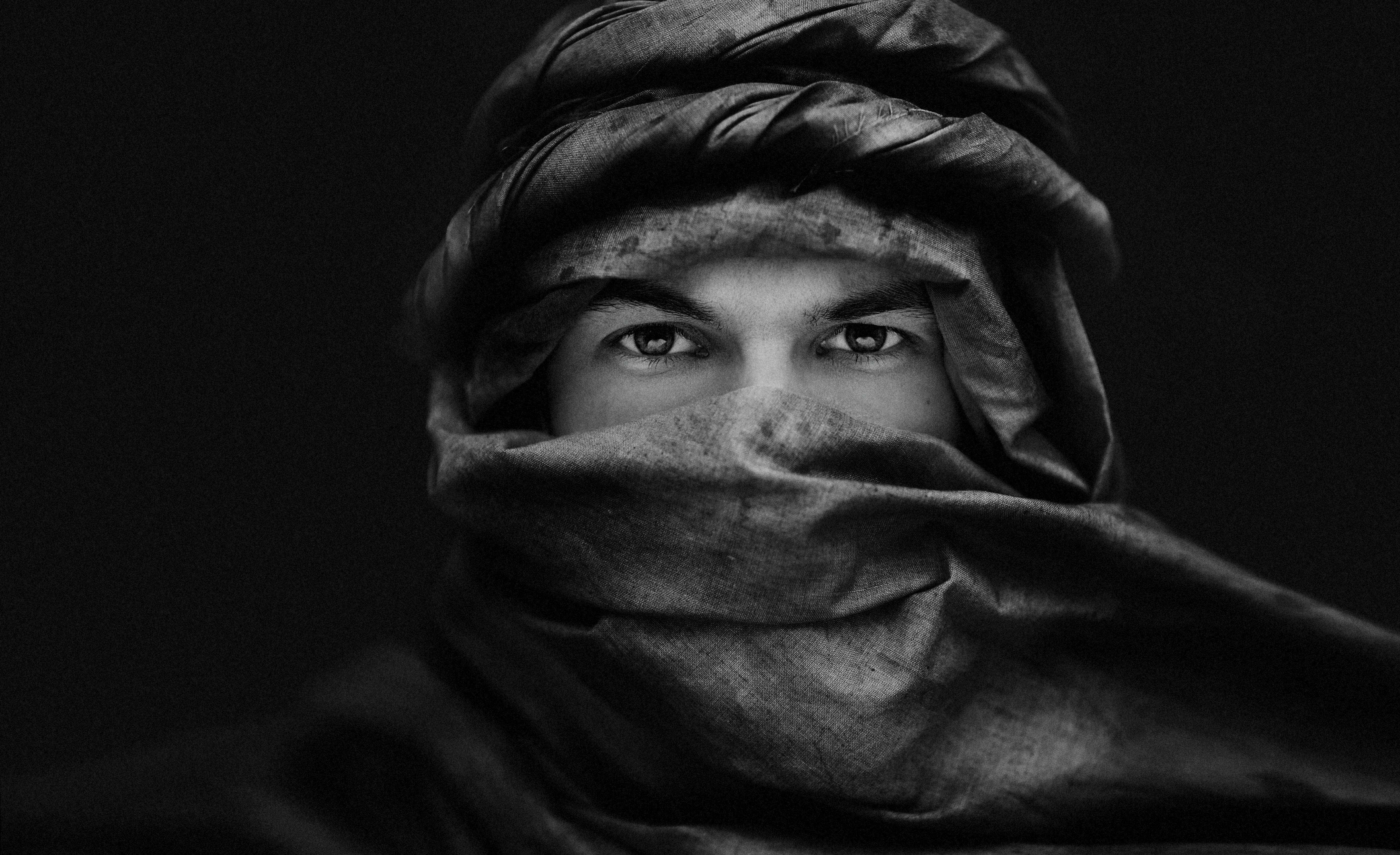 Man wearing a traditional headscarf and veil