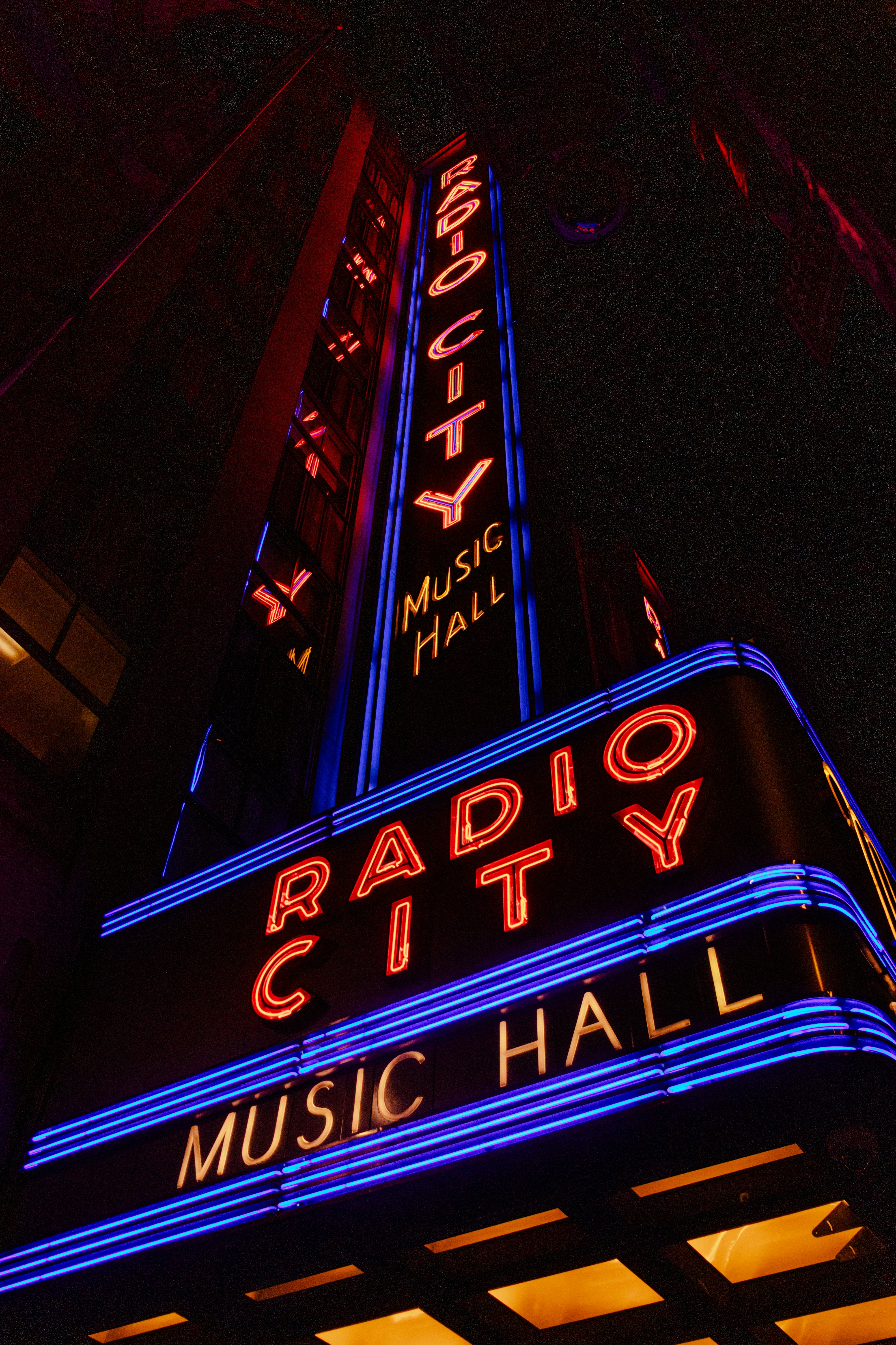Radio city music hall illuminated at night