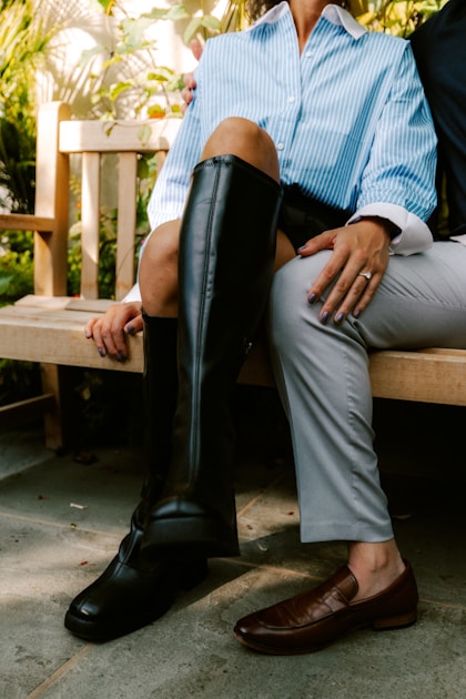 Hunter wearing knee-high gaiters walking through wet brush and tall grass