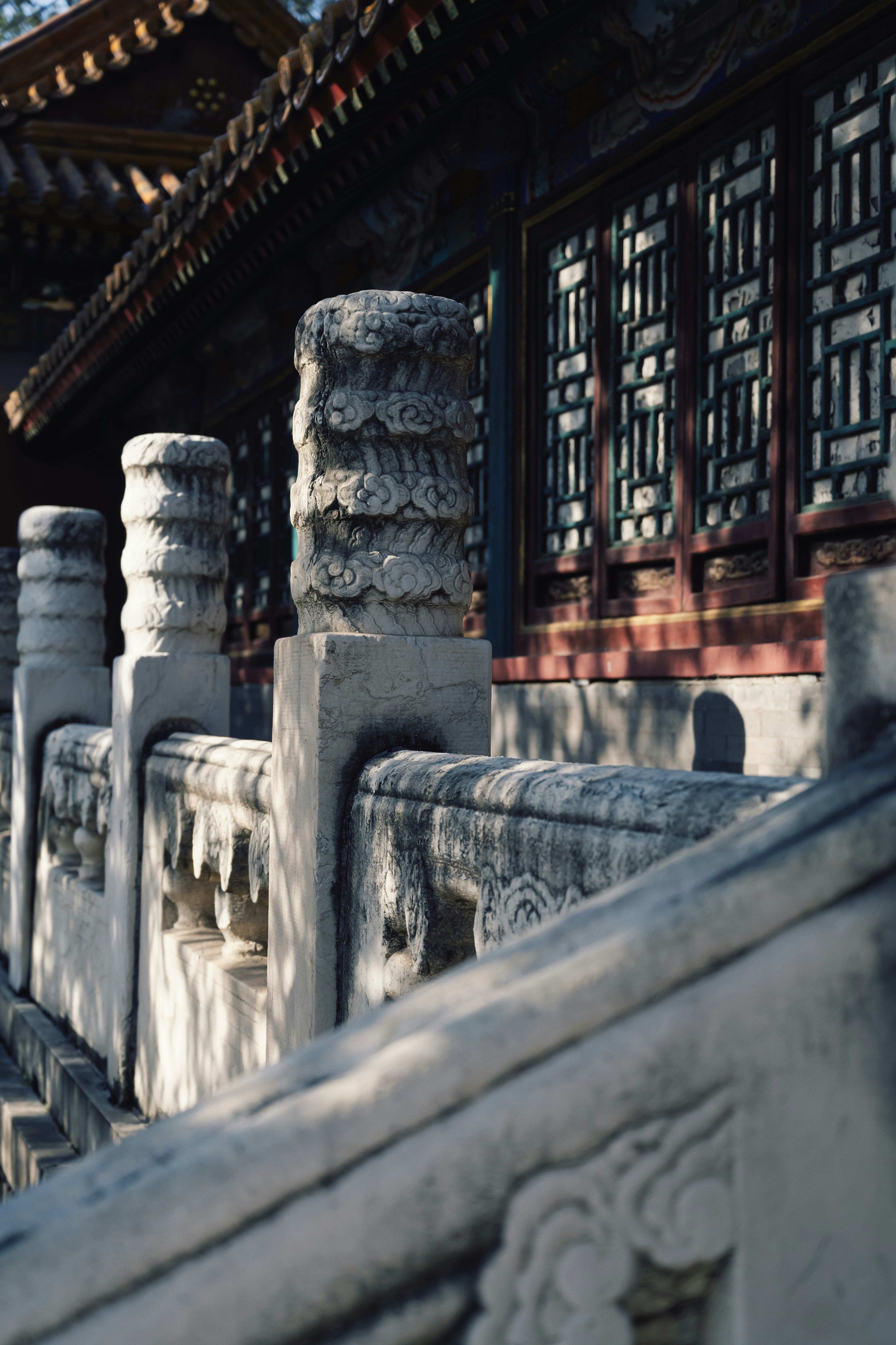 Stone railing in front of traditional chinese building