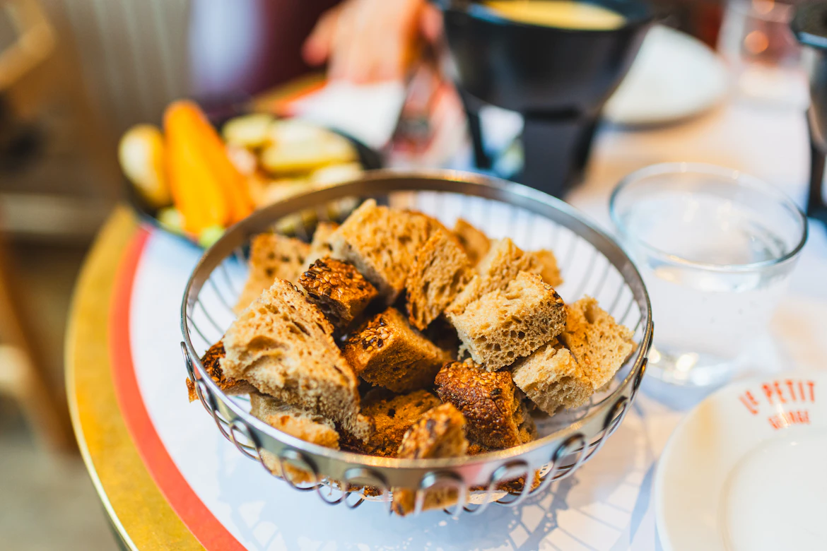 Rustic bread cubes fill a wire basket