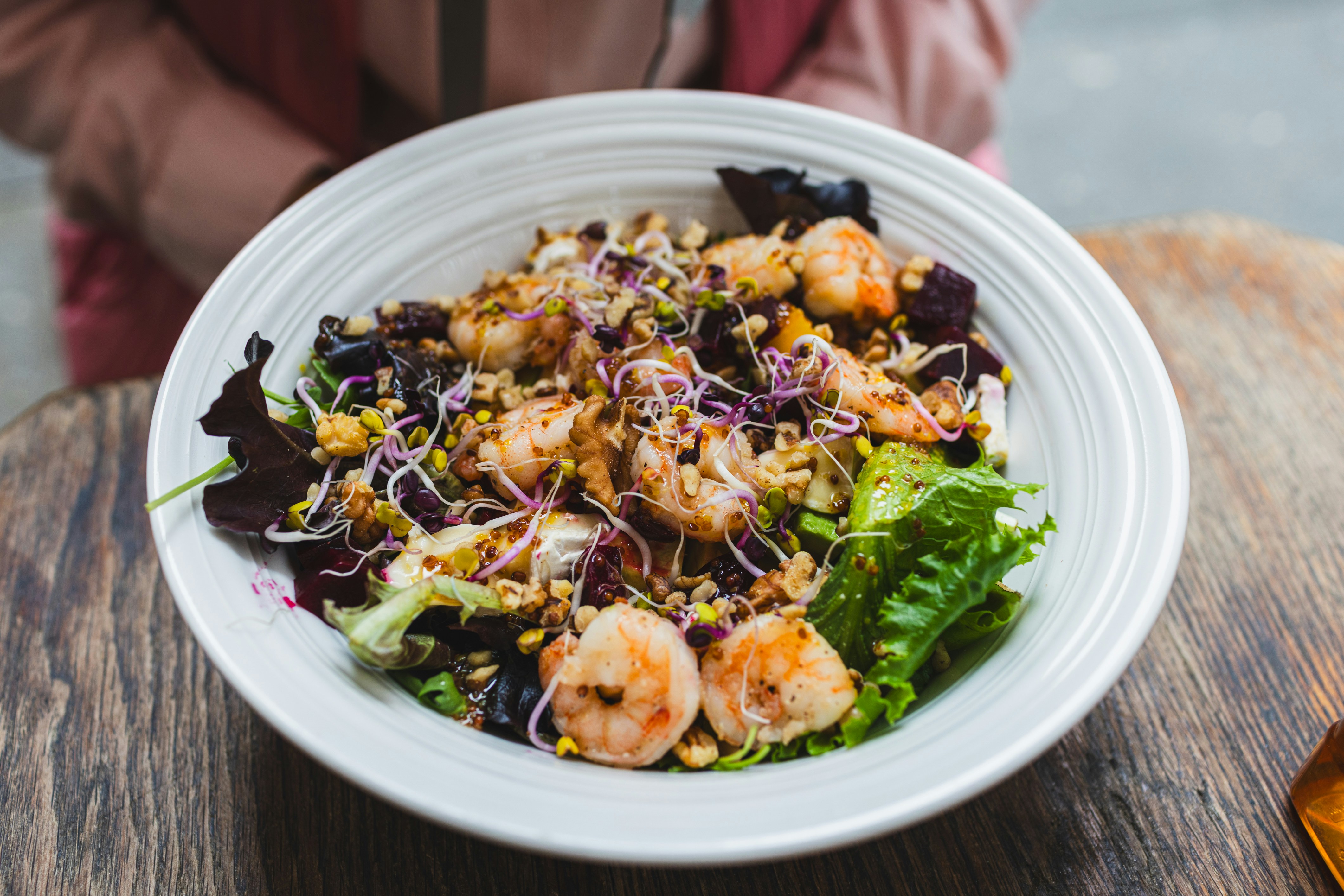 Shrimp and grain salad with fresh greens.