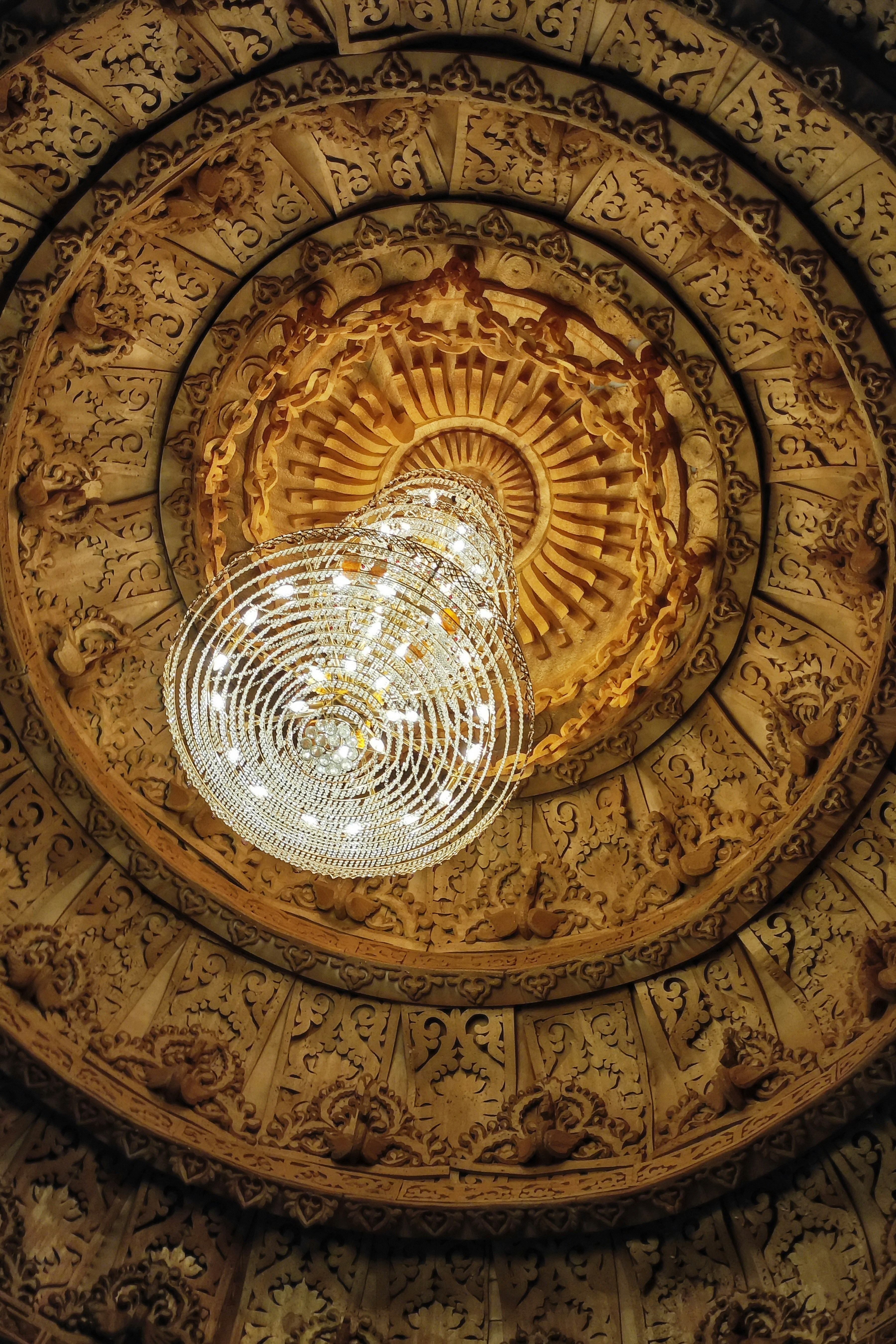Elaborate ornate ceiling with a crystal chandelier.