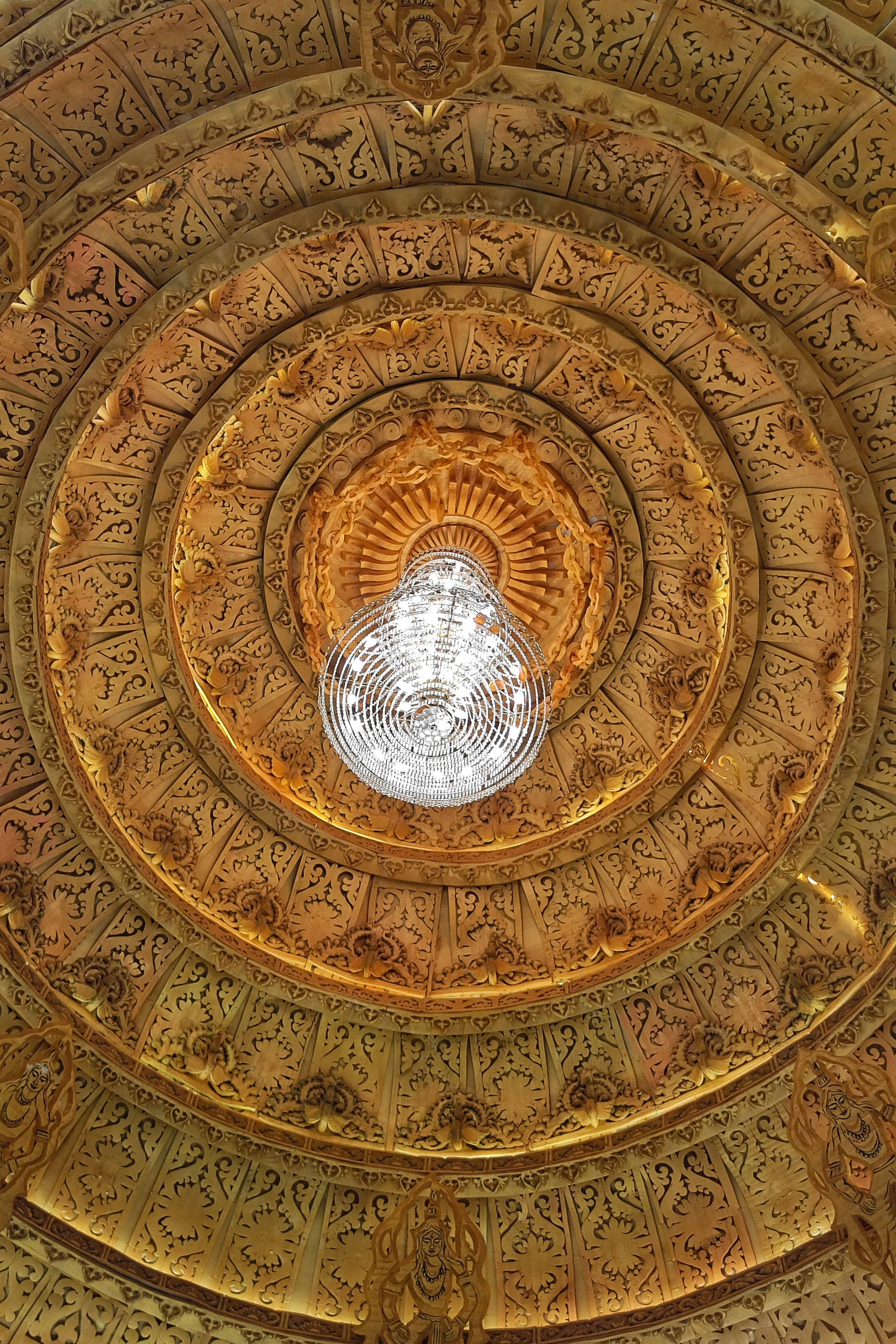 Ornate golden ceiling with a crystal chandelier