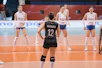 Volleyball players on court during a match