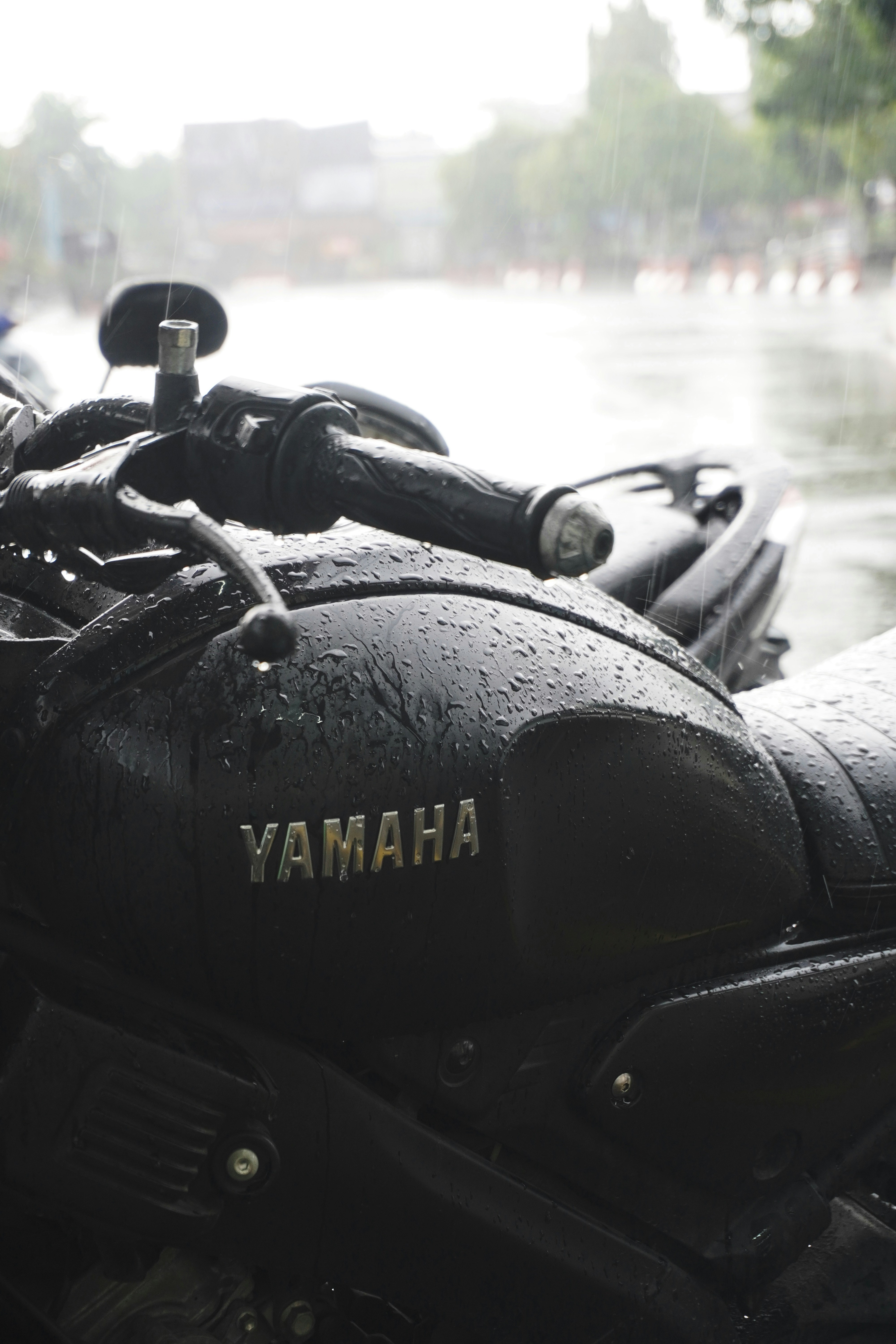 Black yamaha motorcycle in the rain