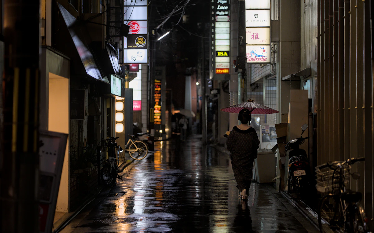 Kyoto Japan rain at night wet streets reflection lanterns