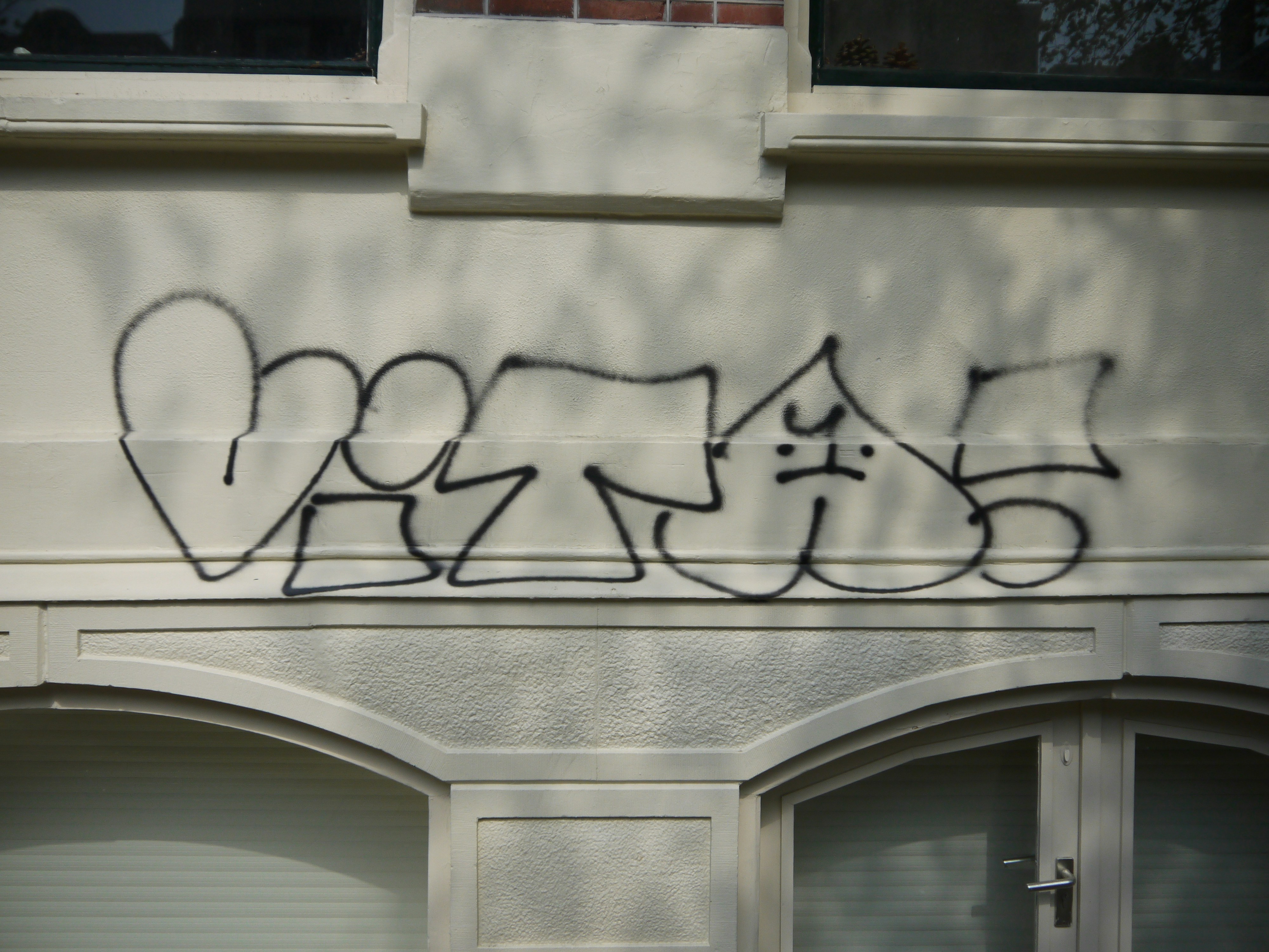 Graffiti tag on a building facade