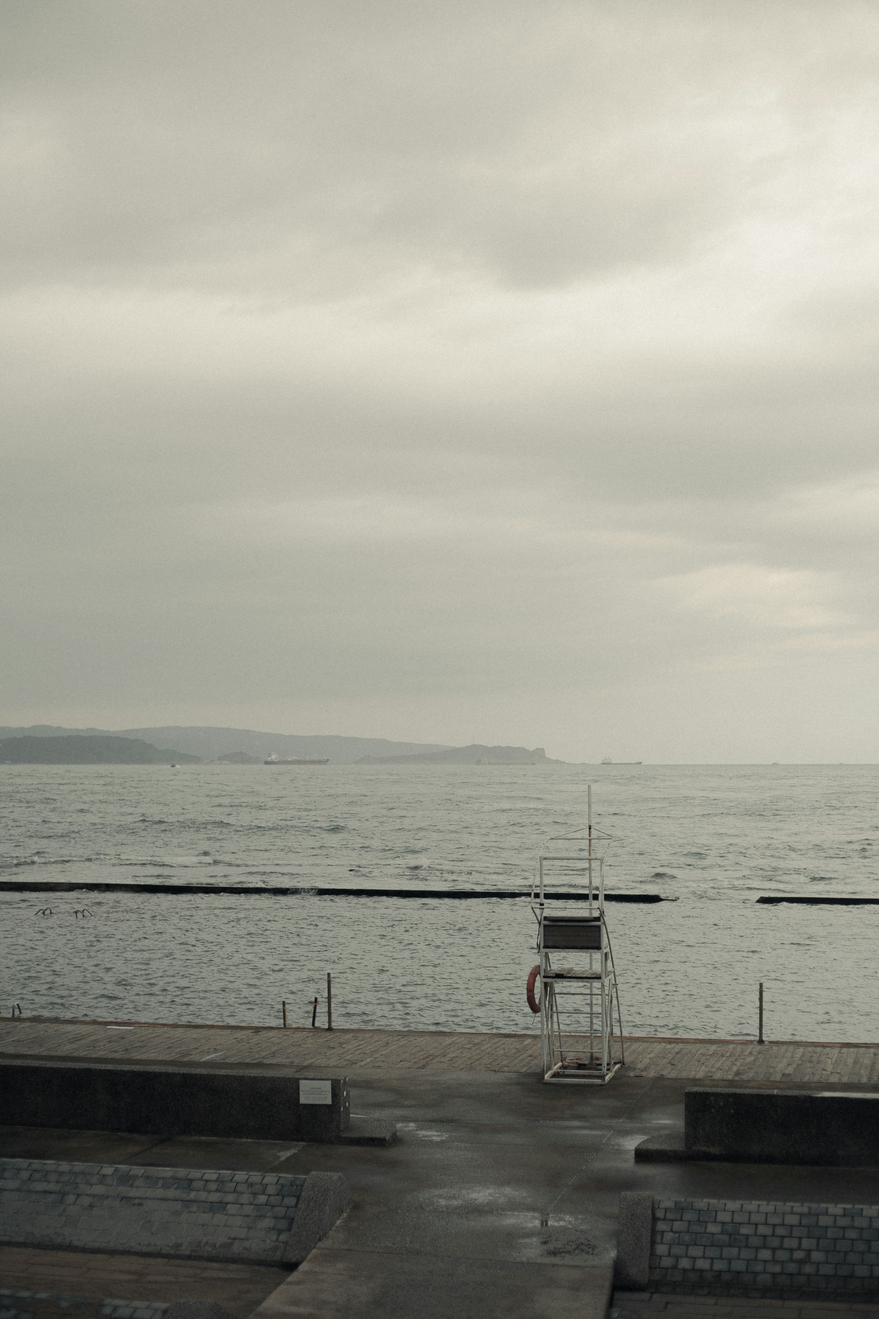Lifeguard tower by the ocean on a cloudy day