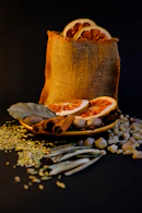 Dried orange slices and spices in burlap bag