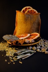 Dried orange slices and spices in burlap bag