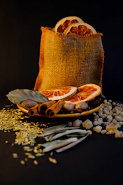Dried orange slices and spices in burlap bag