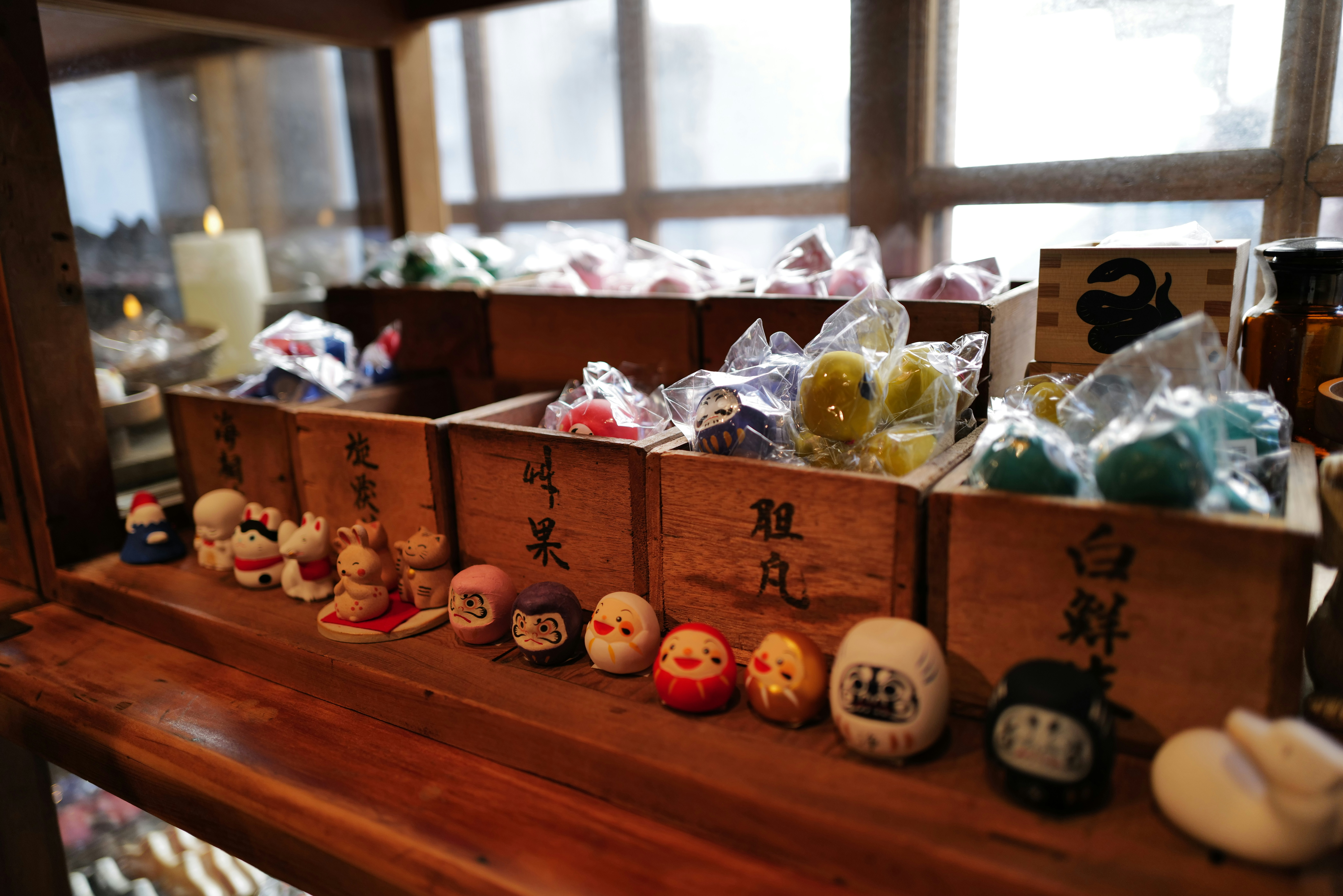 Wooden boxes filled with small trinkets and dolls