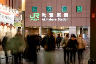 People entering akihabara station at night