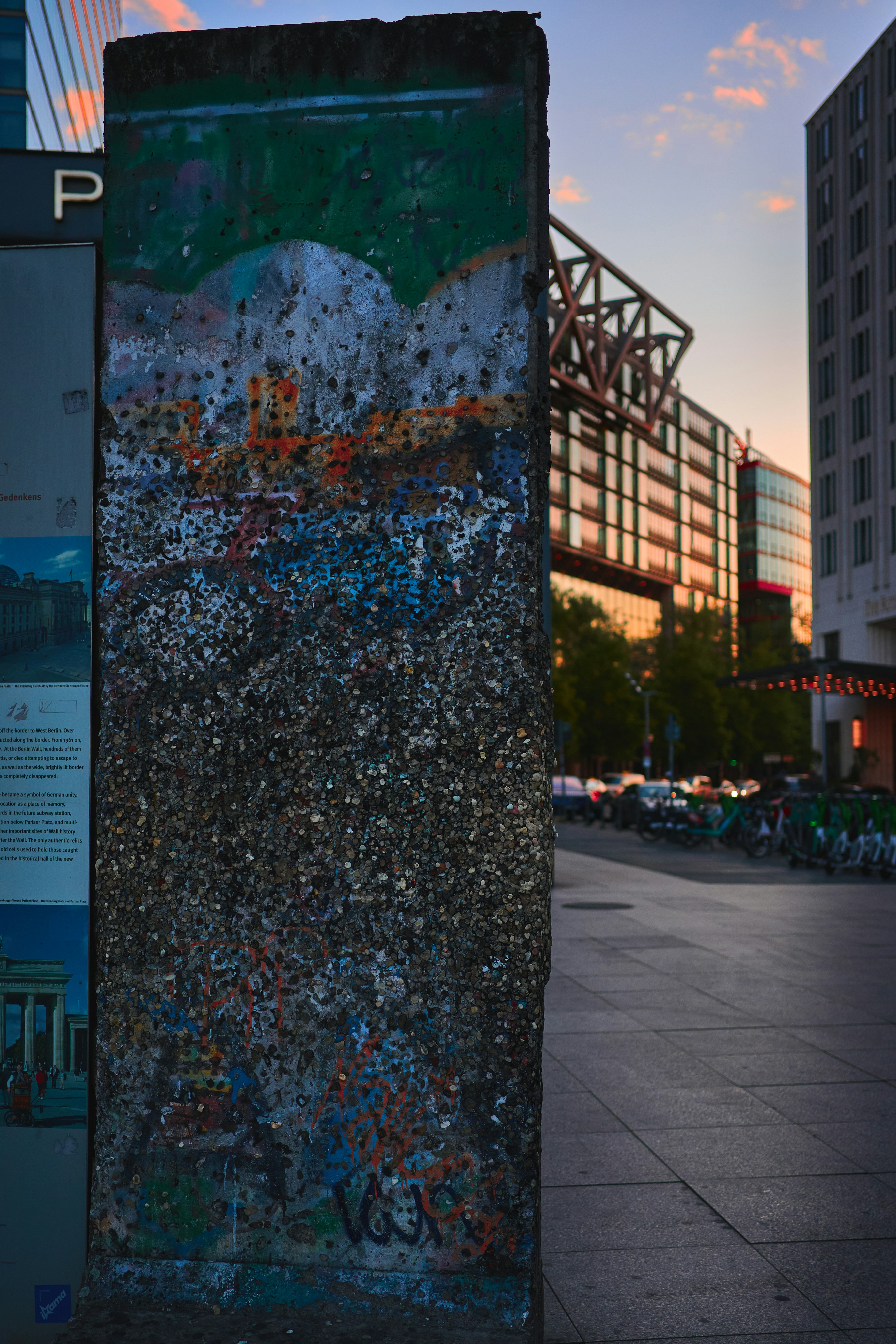 Graffiti covered berlin wall section at sunset