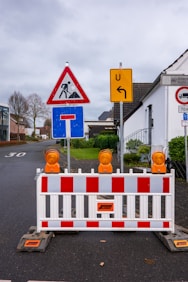 Road construction signs and barrier on a street