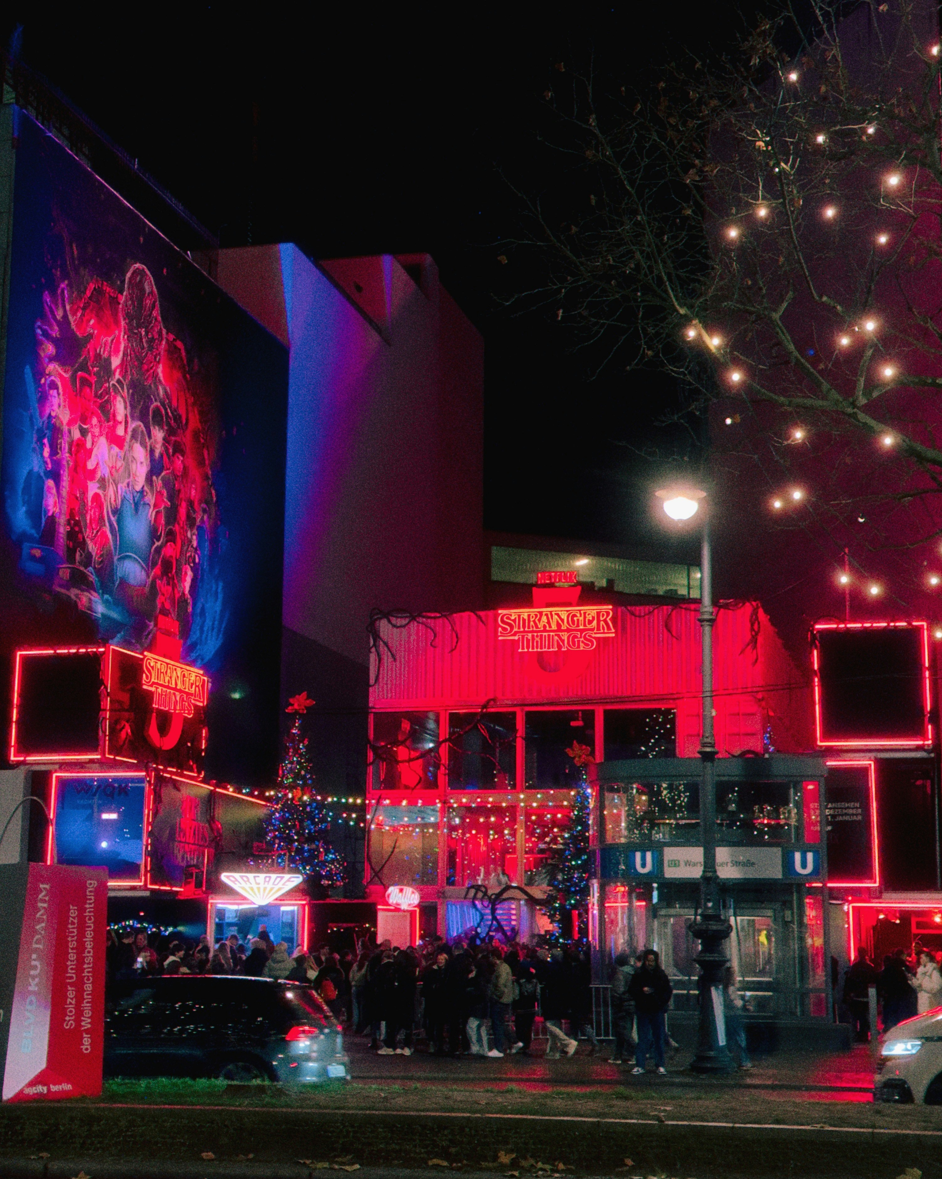 City street at night with neon lights and crowds