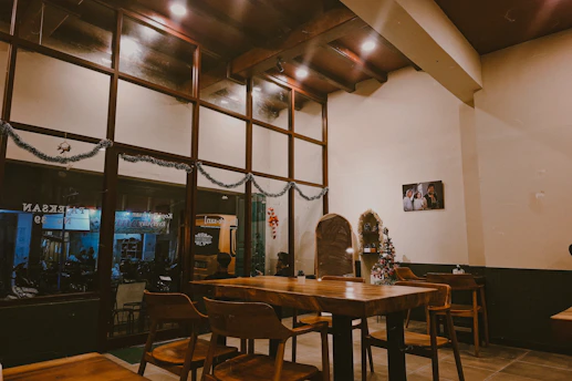 Cozy cafe interior with wooden tables and chairs