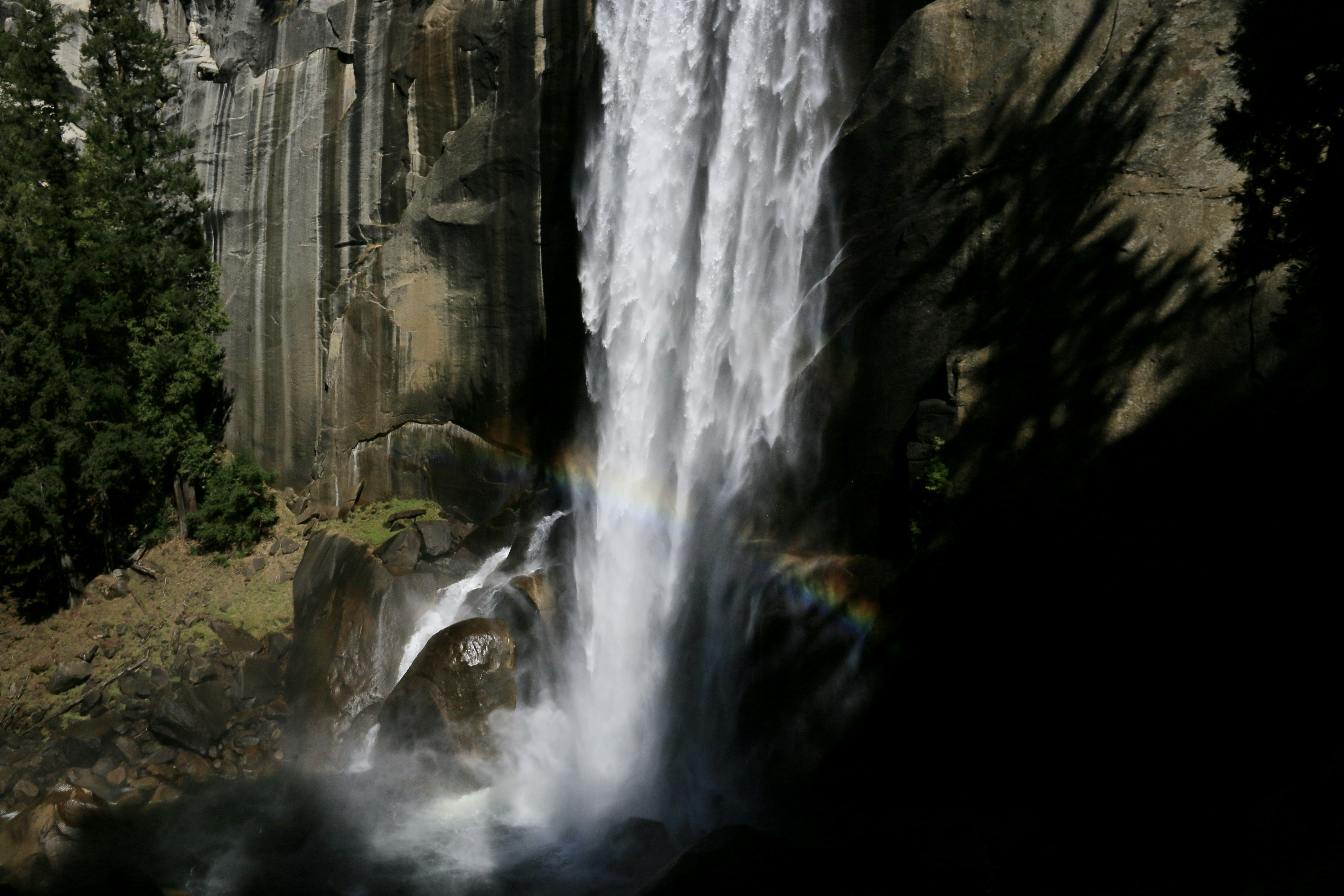 A majestic waterfall cascades down a rocky cliff face.