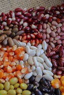 Assortment of dried beans and corn kernels.