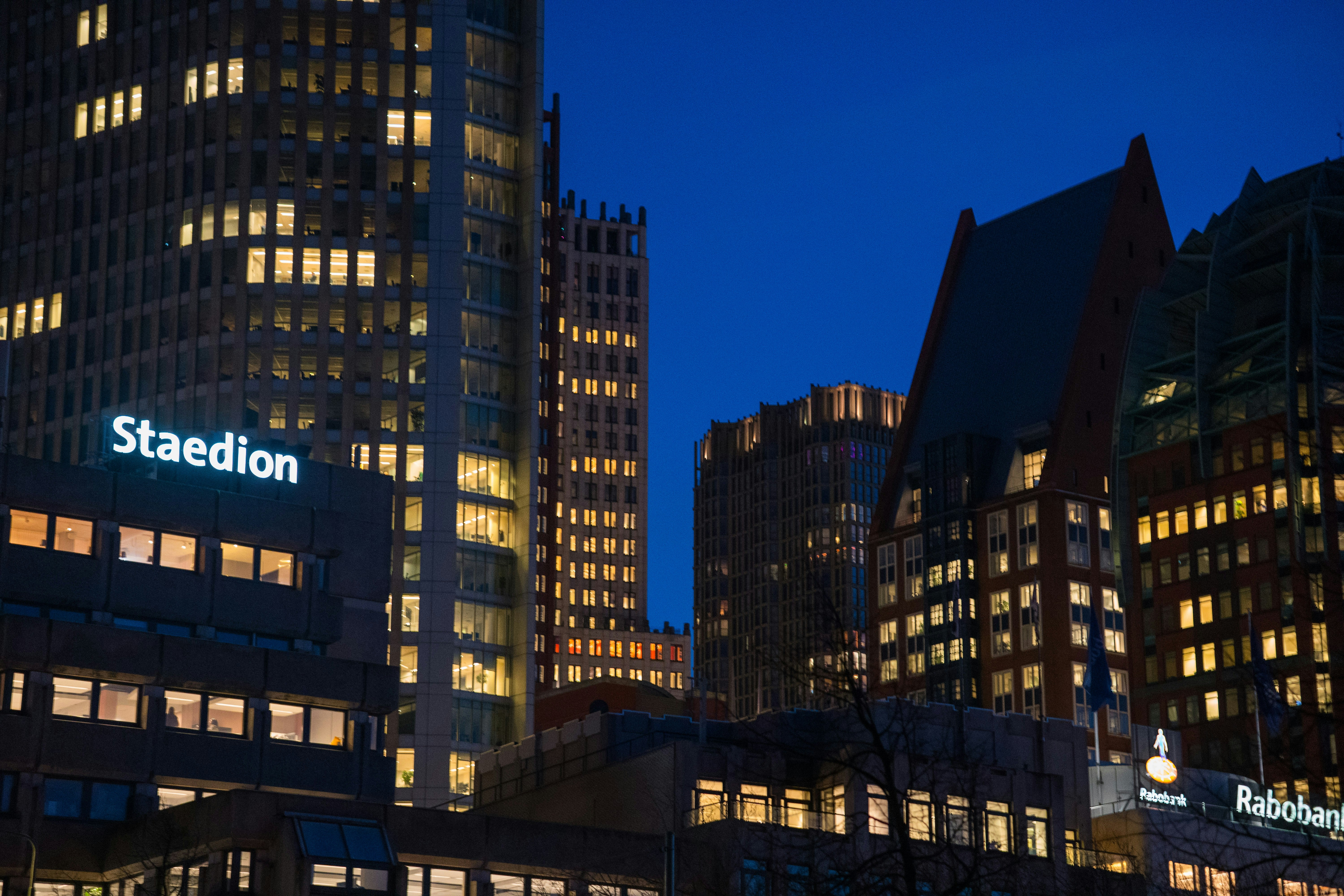 Modern office buildings illuminated at dusk