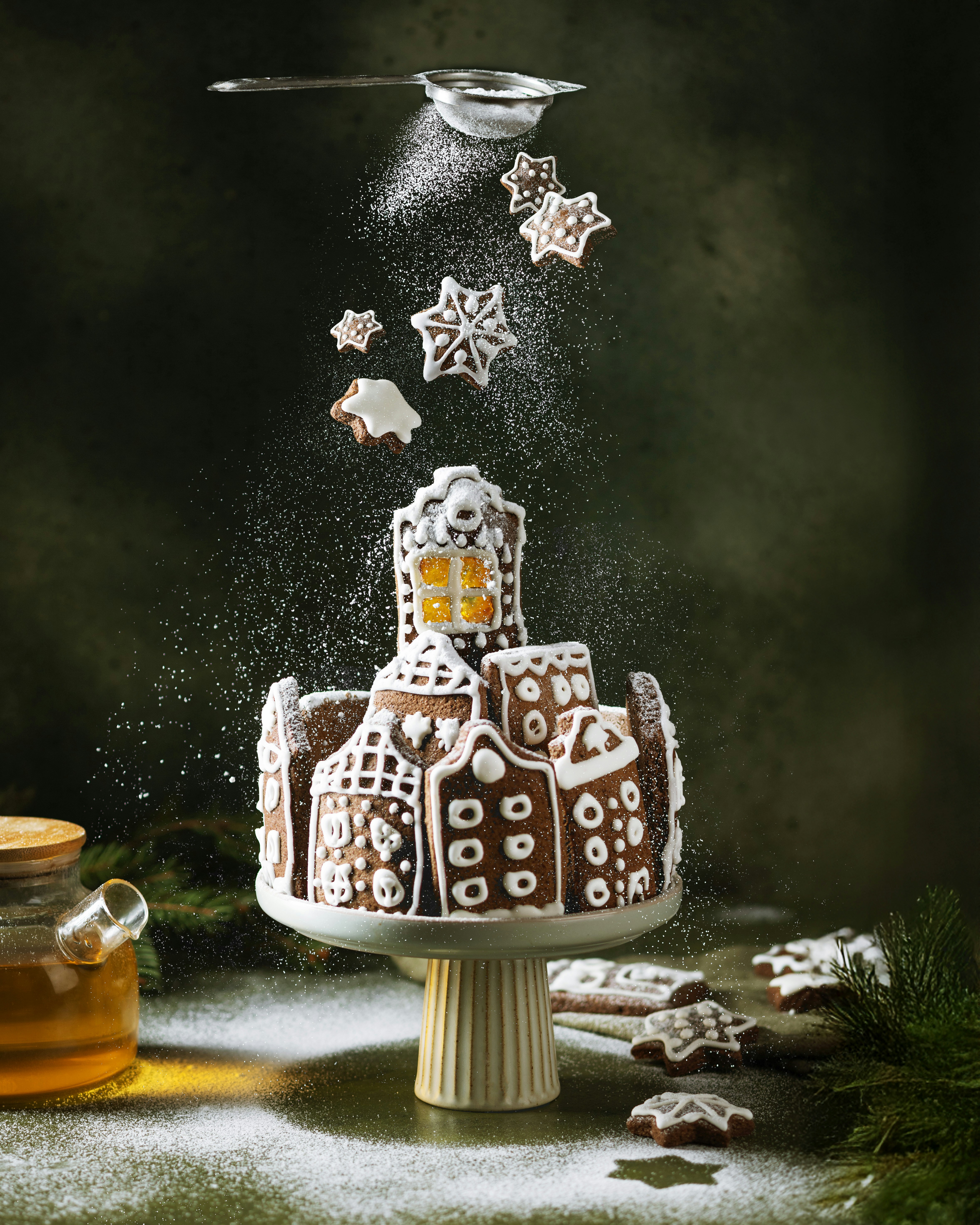 Gingerbread village with powdered sugar falling