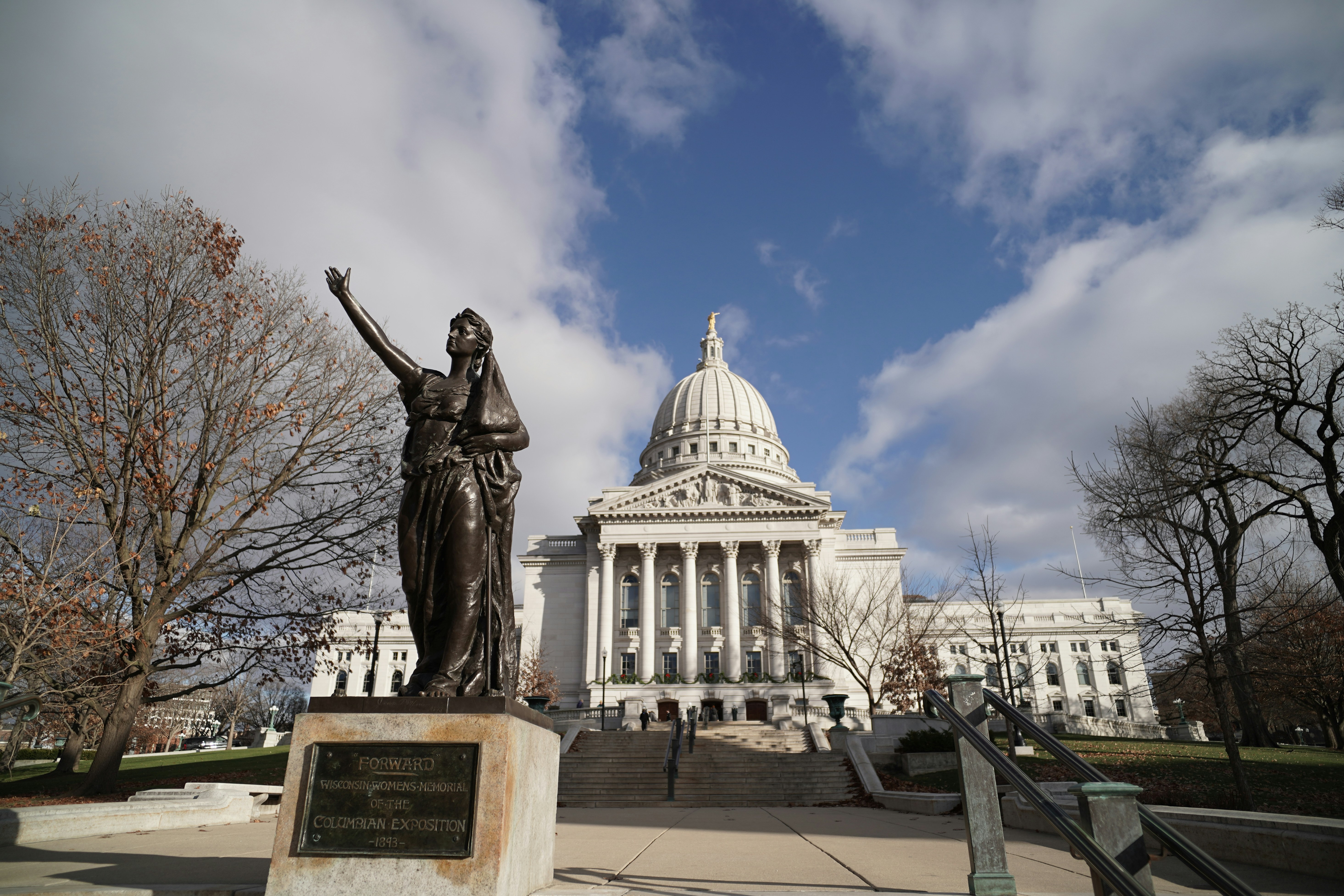 Grand building with a statue in front