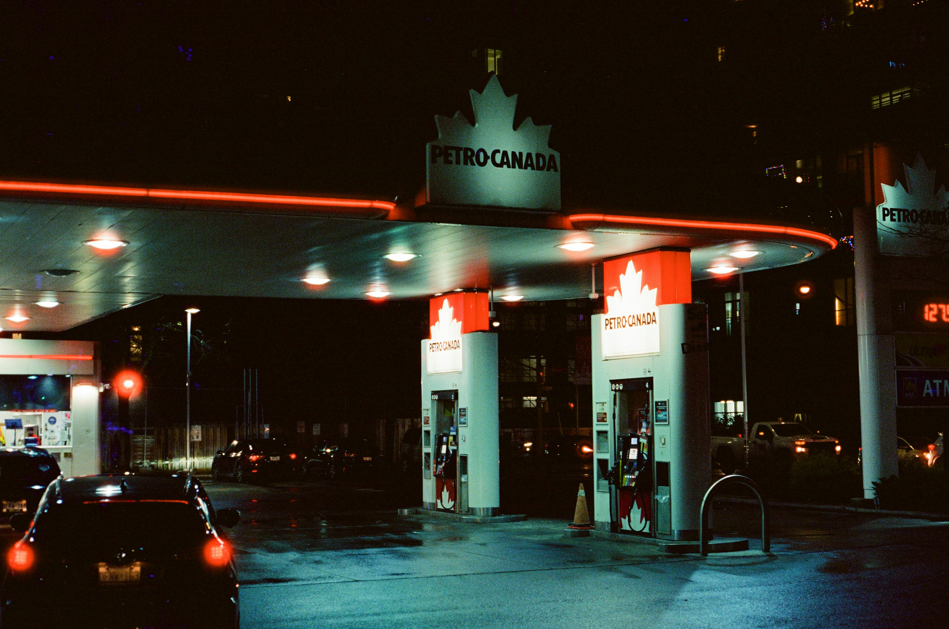 Petro canada gas station at night with red neon lights