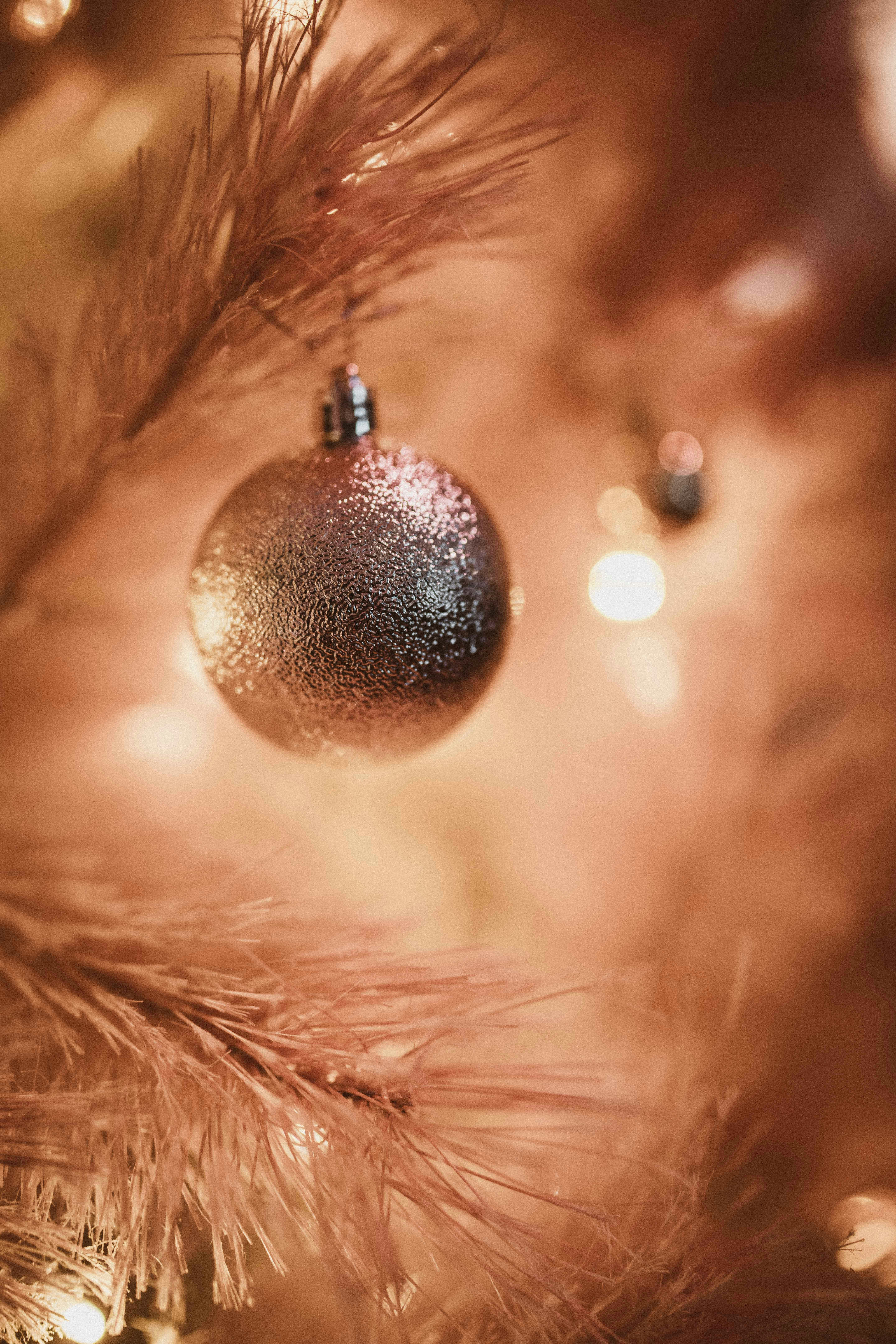 A close-up of a christmas ornament on a tree.