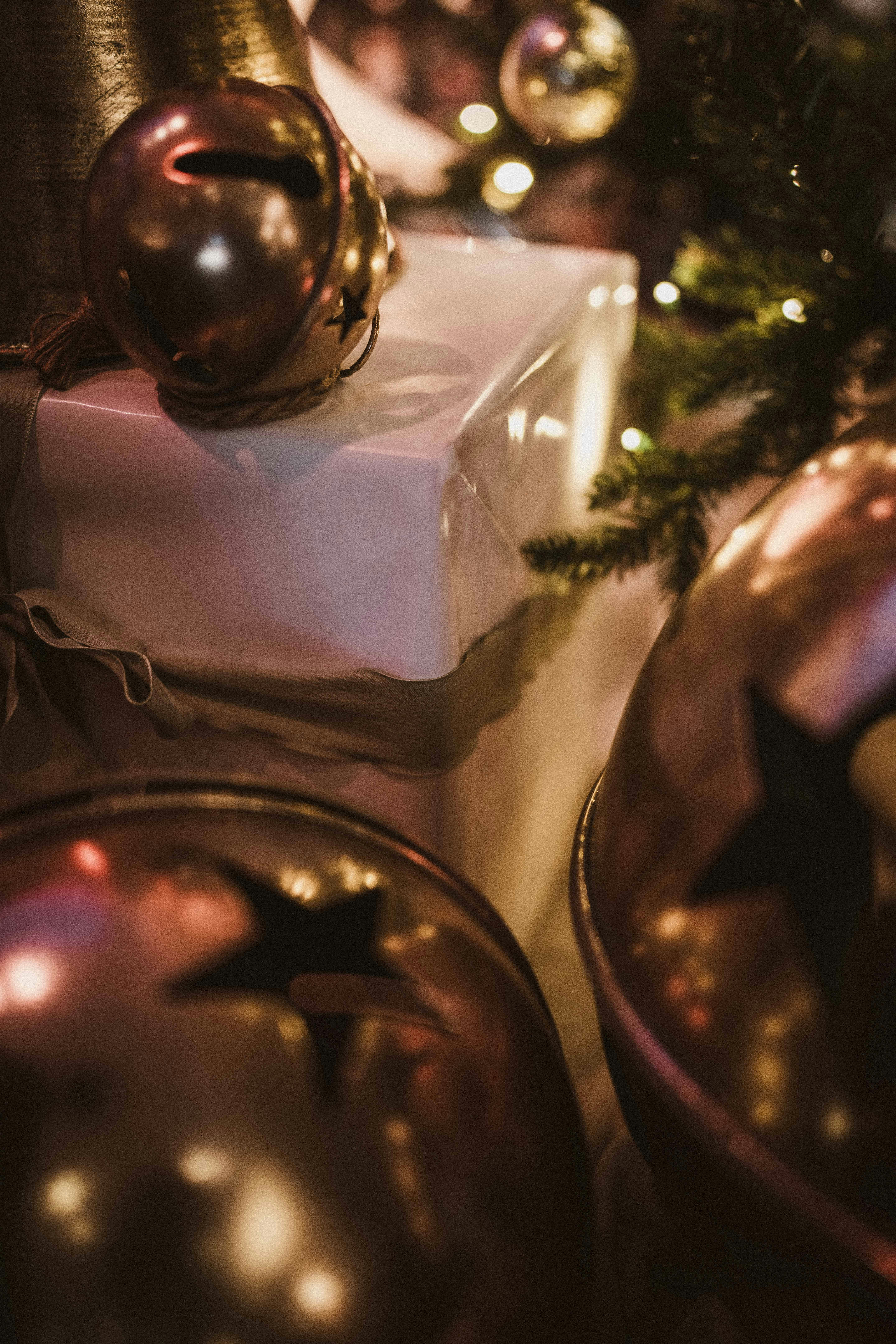 Christmas ornaments and wrapped gifts under tree