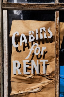 Cabins for rent sign on a window.