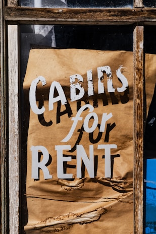 Cabins for rent sign on a window.