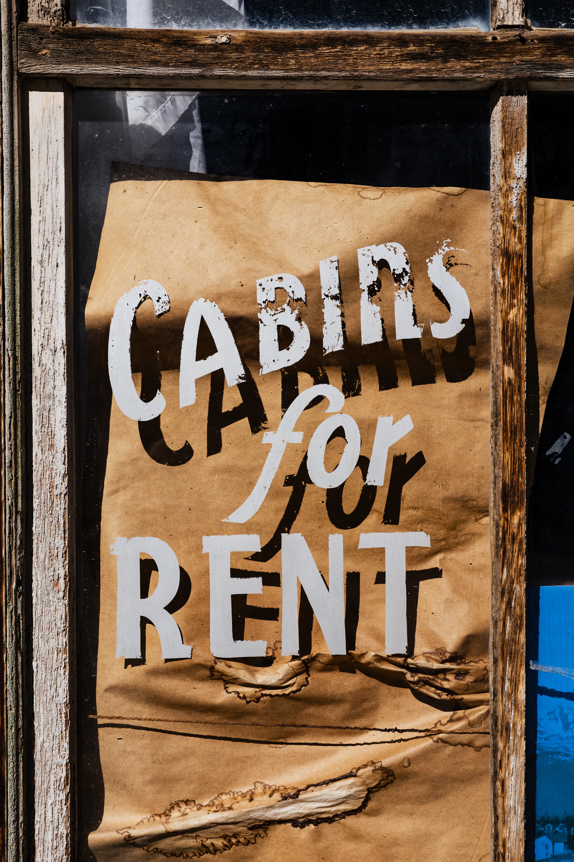 Cabins for rent sign on a window.