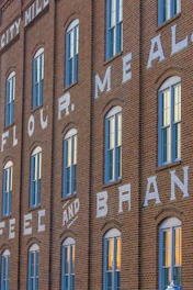 Brick building with windows and text