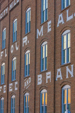 Brick building with windows and text