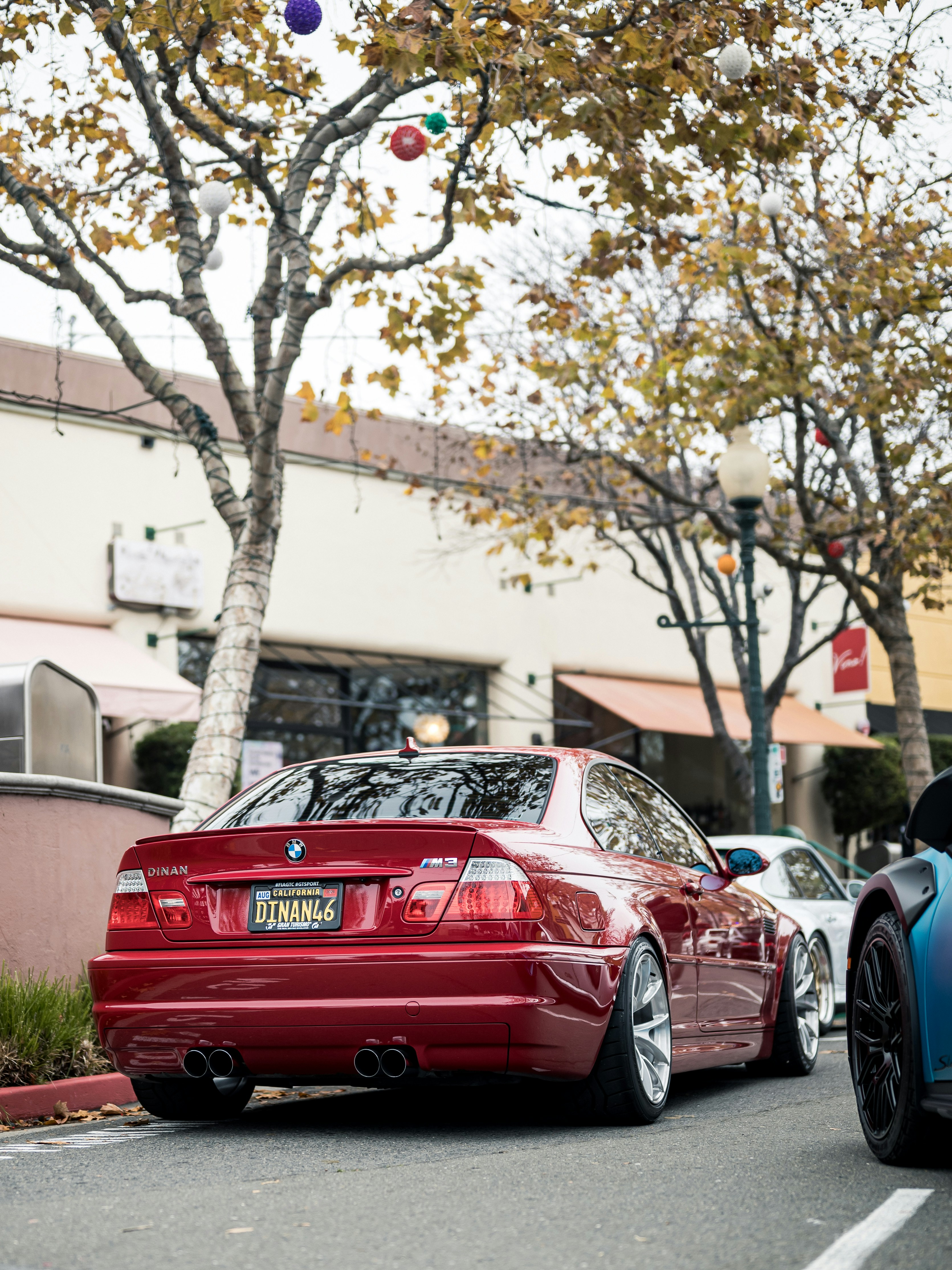 Red BMW m3 parked on a street