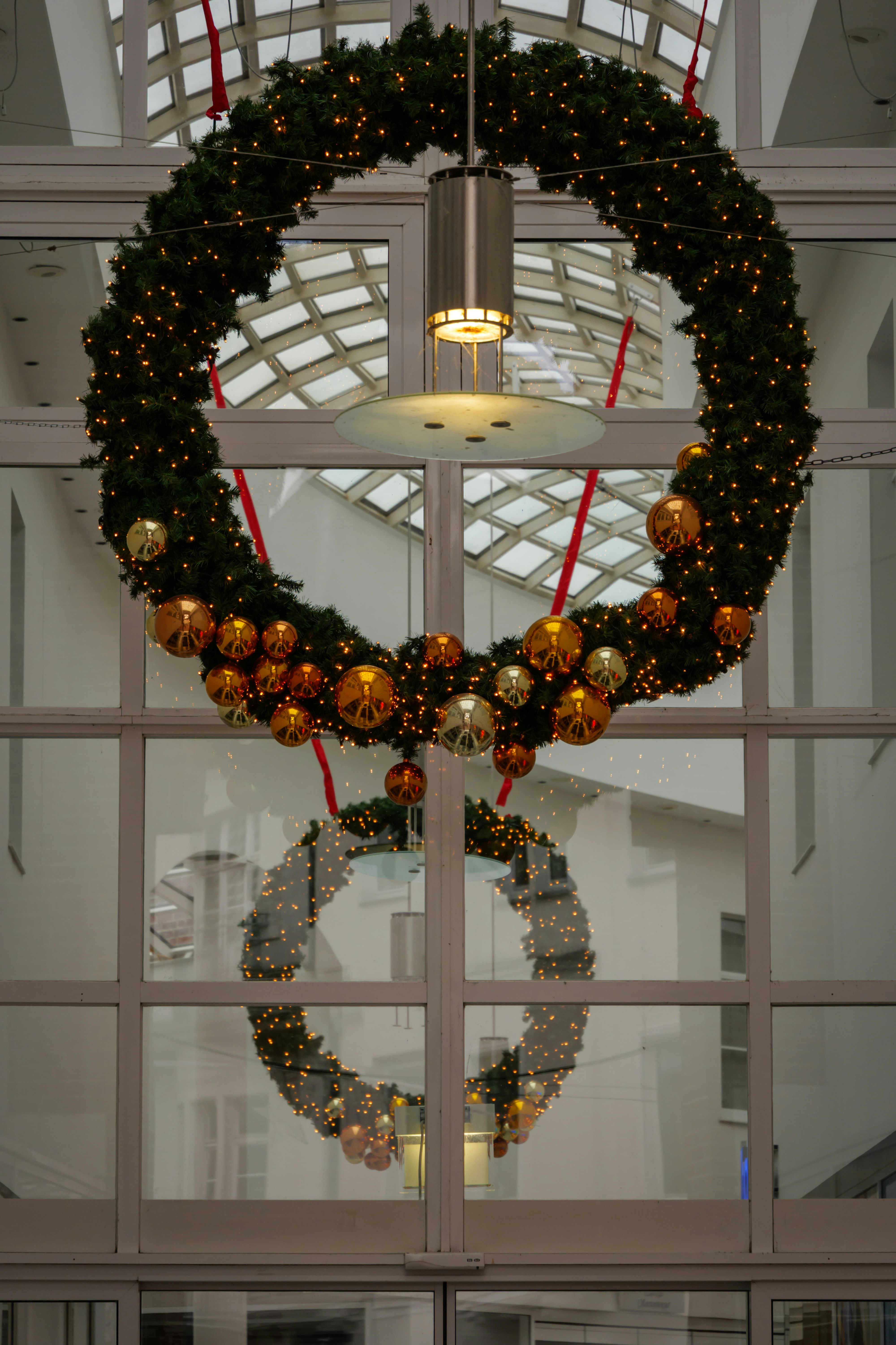 Large christmas wreath with golden ornaments and lights