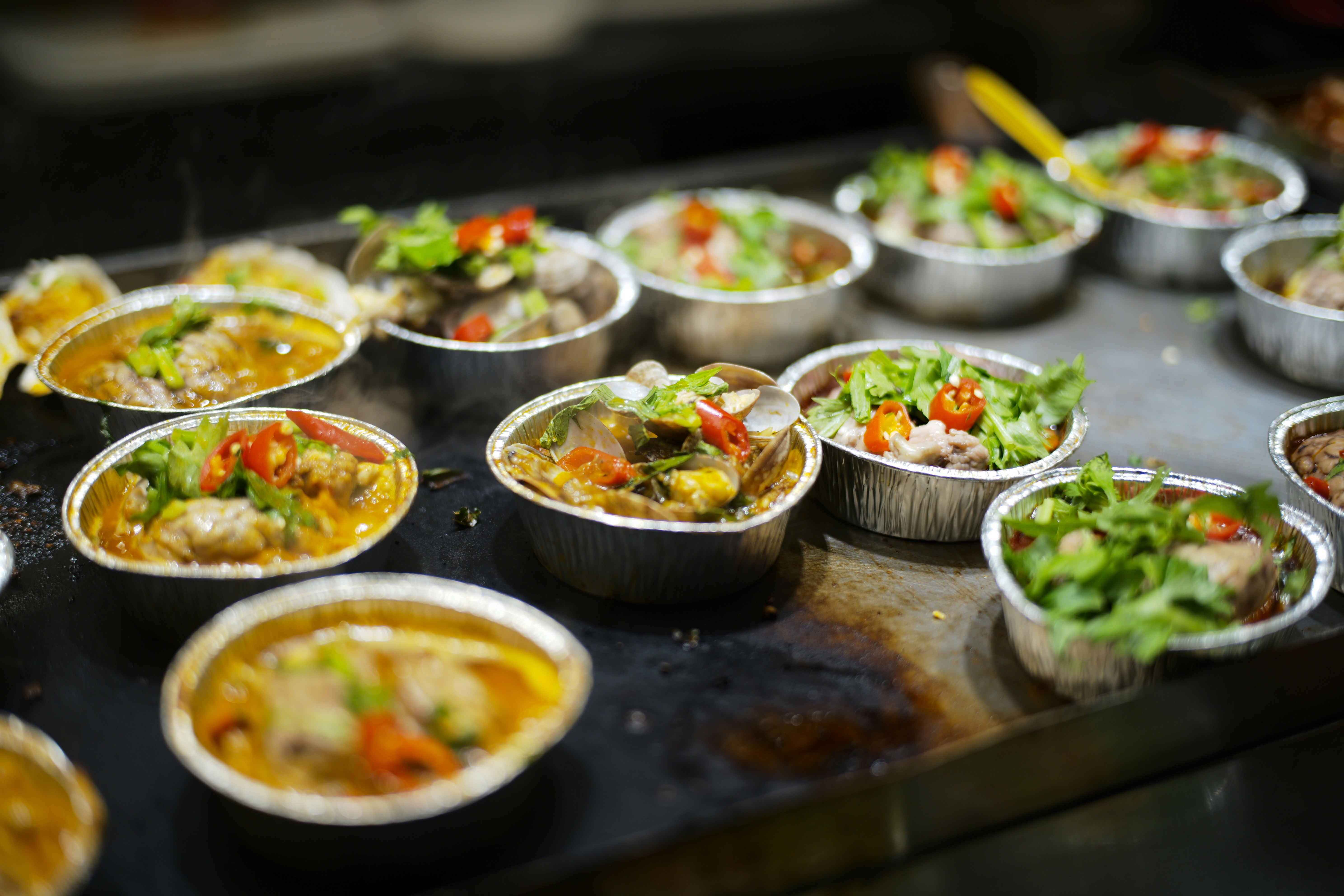 Small servings of food in foil containers