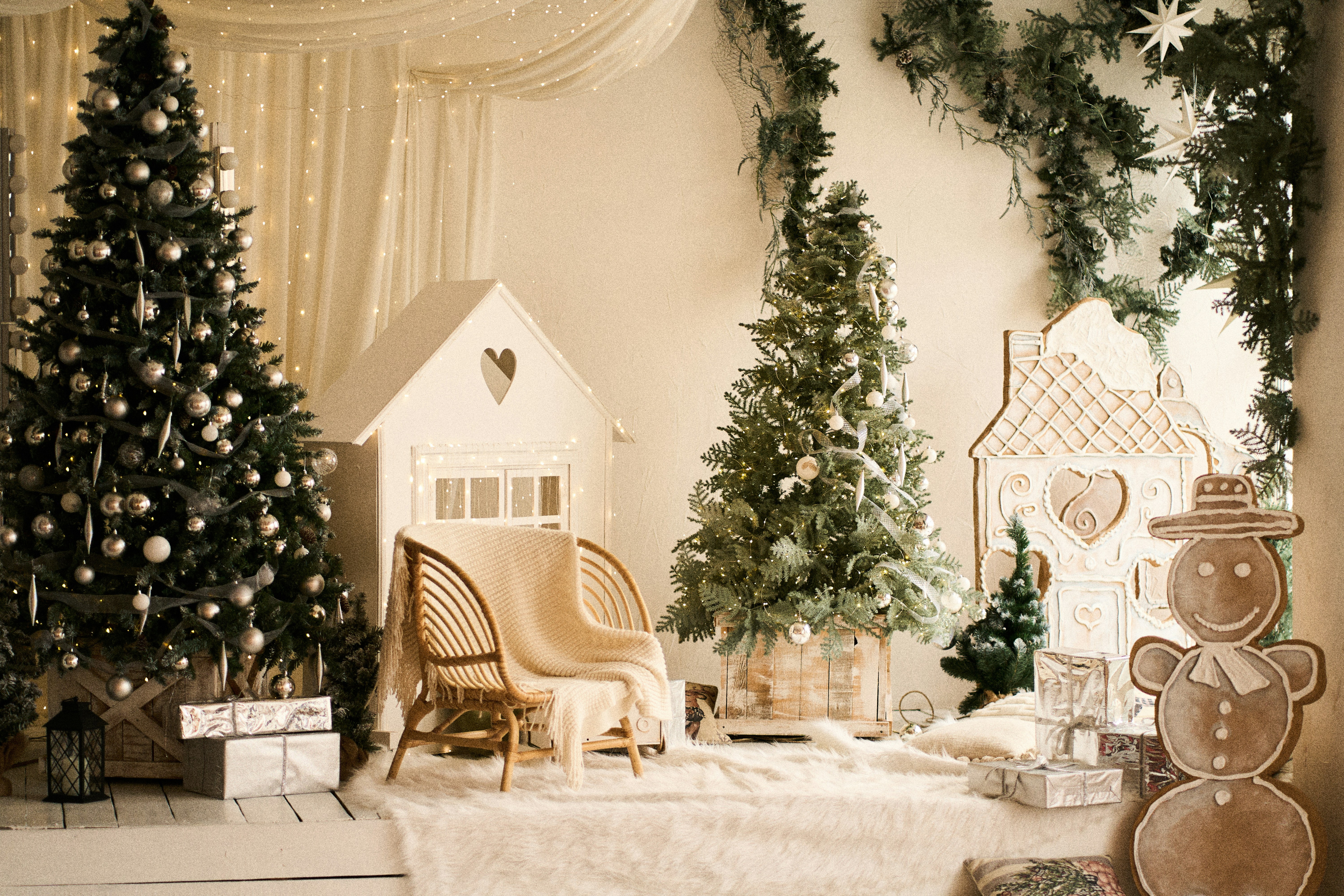 Cozy christmas scene with decorated trees and gifts.
