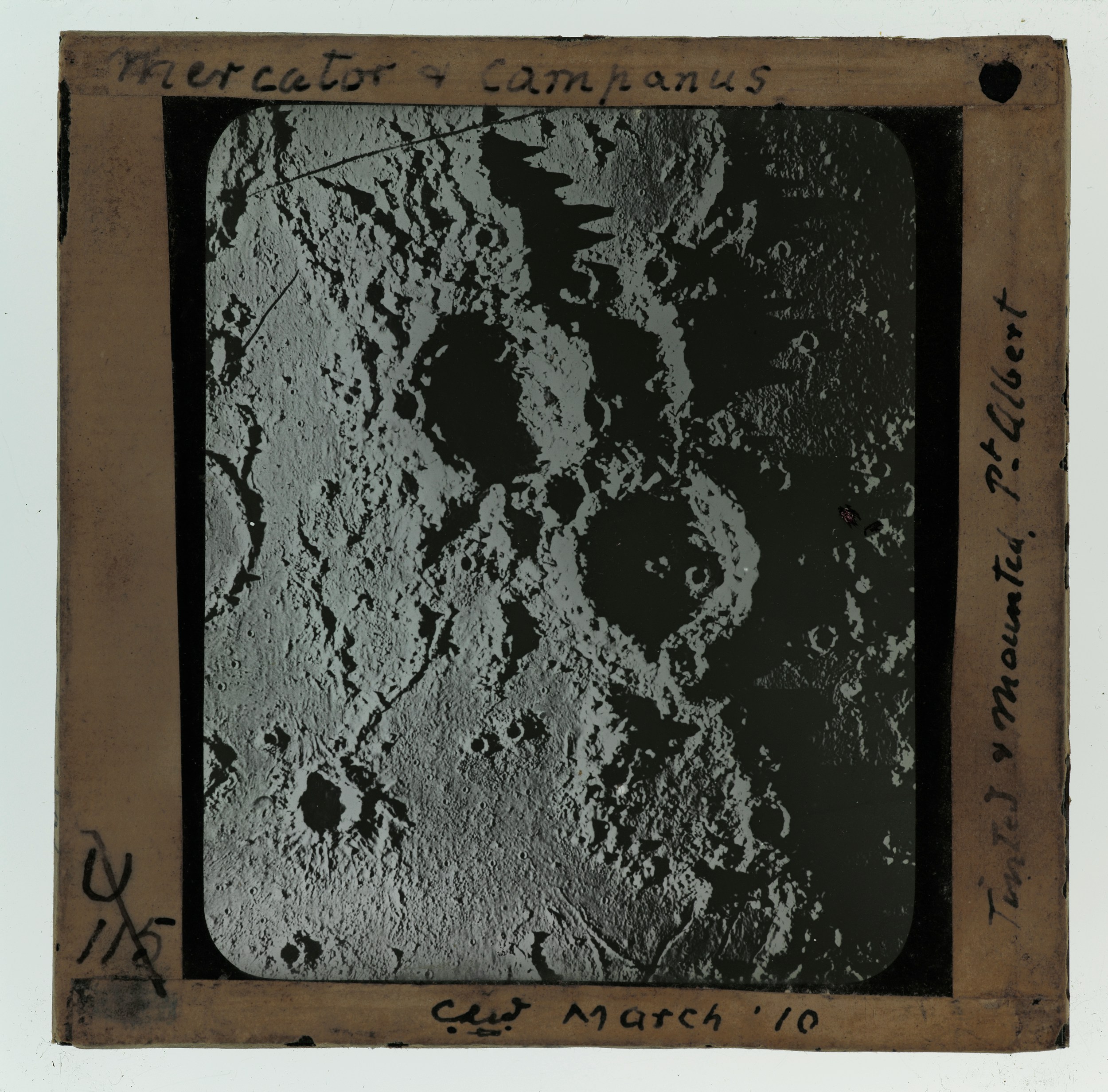 Surface of the moon with craters and mountains.