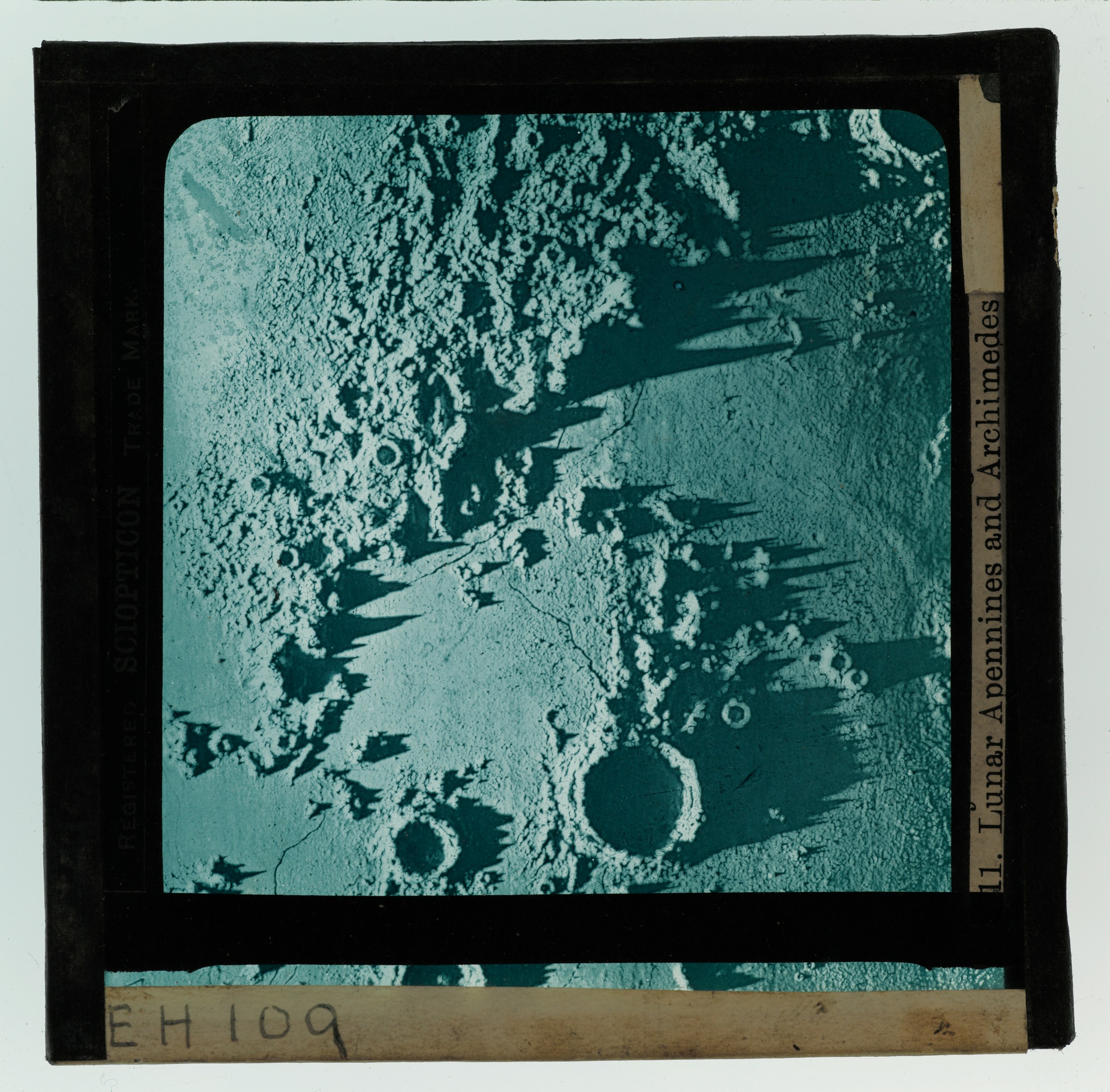 Lunar surface with craters and long shadows