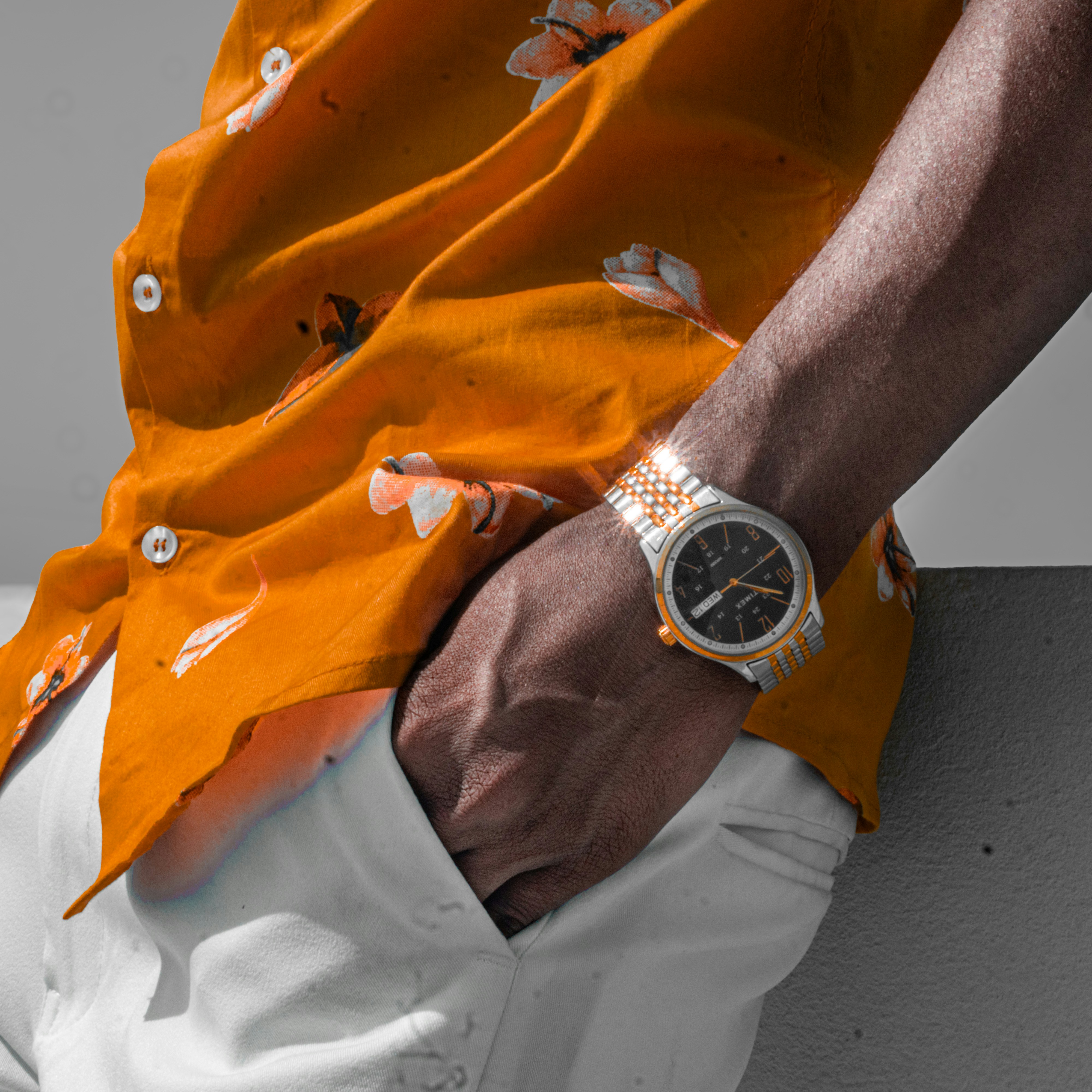Man wearing a floral shirt and watch