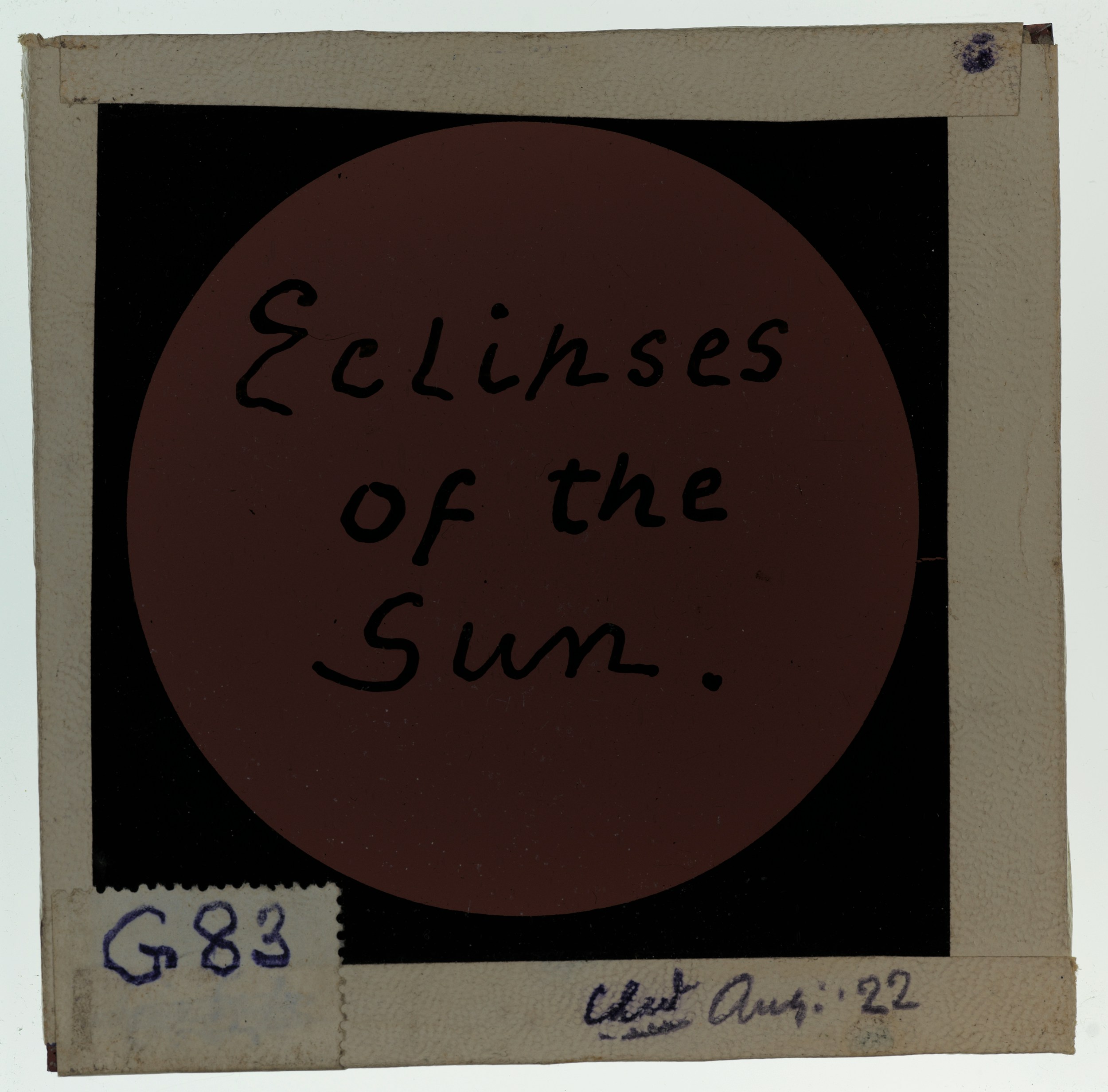 A lantern slide produced by Clement Lindley Wragge (b.1852, d.1922), dated 5 April 1905. The slide shows handwritten text inside pink tinted circle, 'Eclipses of the Sun.'. Shared by Auckland War Memorial Museum, Tāmaki Paenga Hira, as part of the Clement Lindley Wragge collection. 235982|PH-1984-1-LS78-3-53|83. No known copyright restrictions. https://www.aucklandmuseum.com/discover/collections/record/1033233